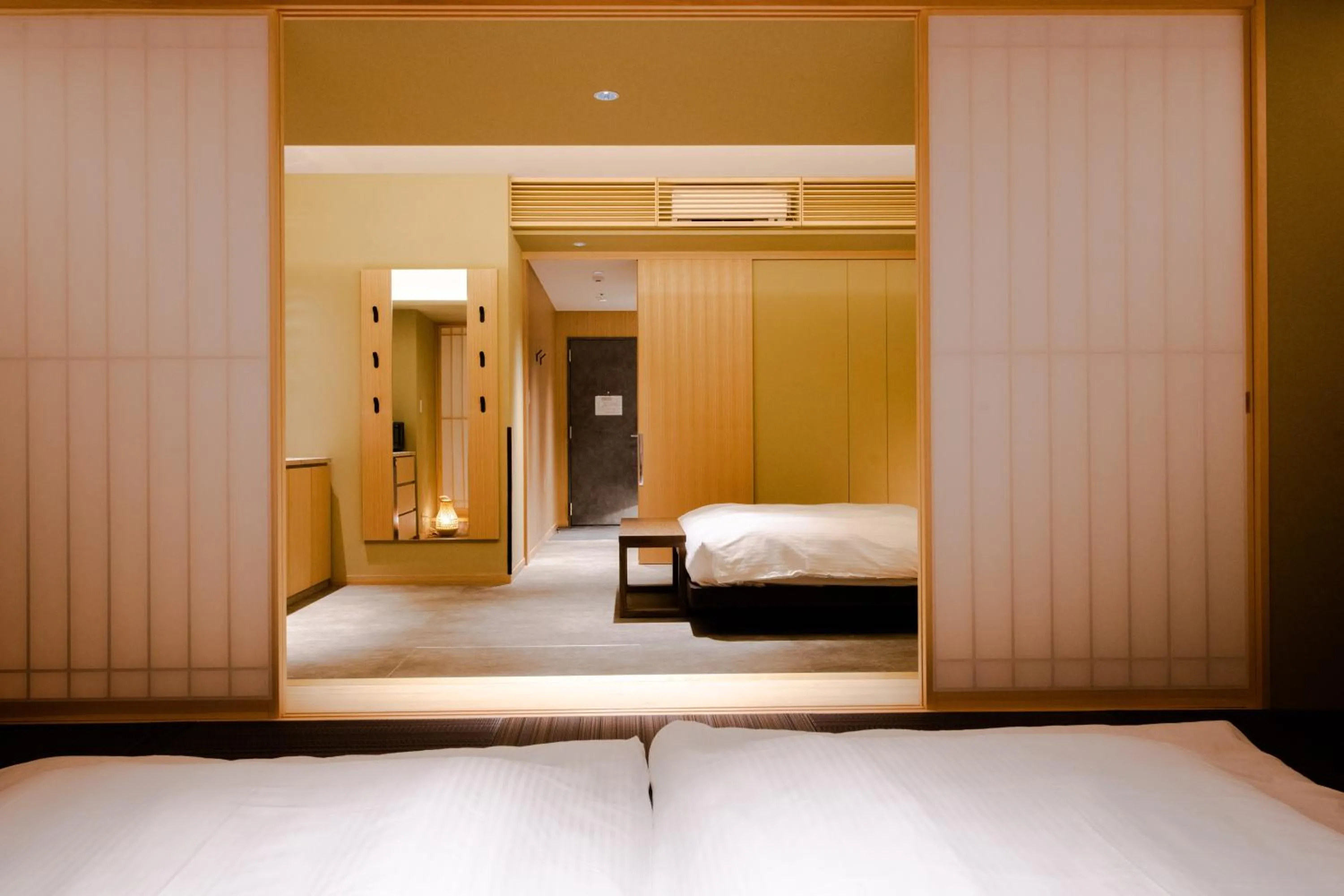 Bed in GuestHouse MIYABI Premium