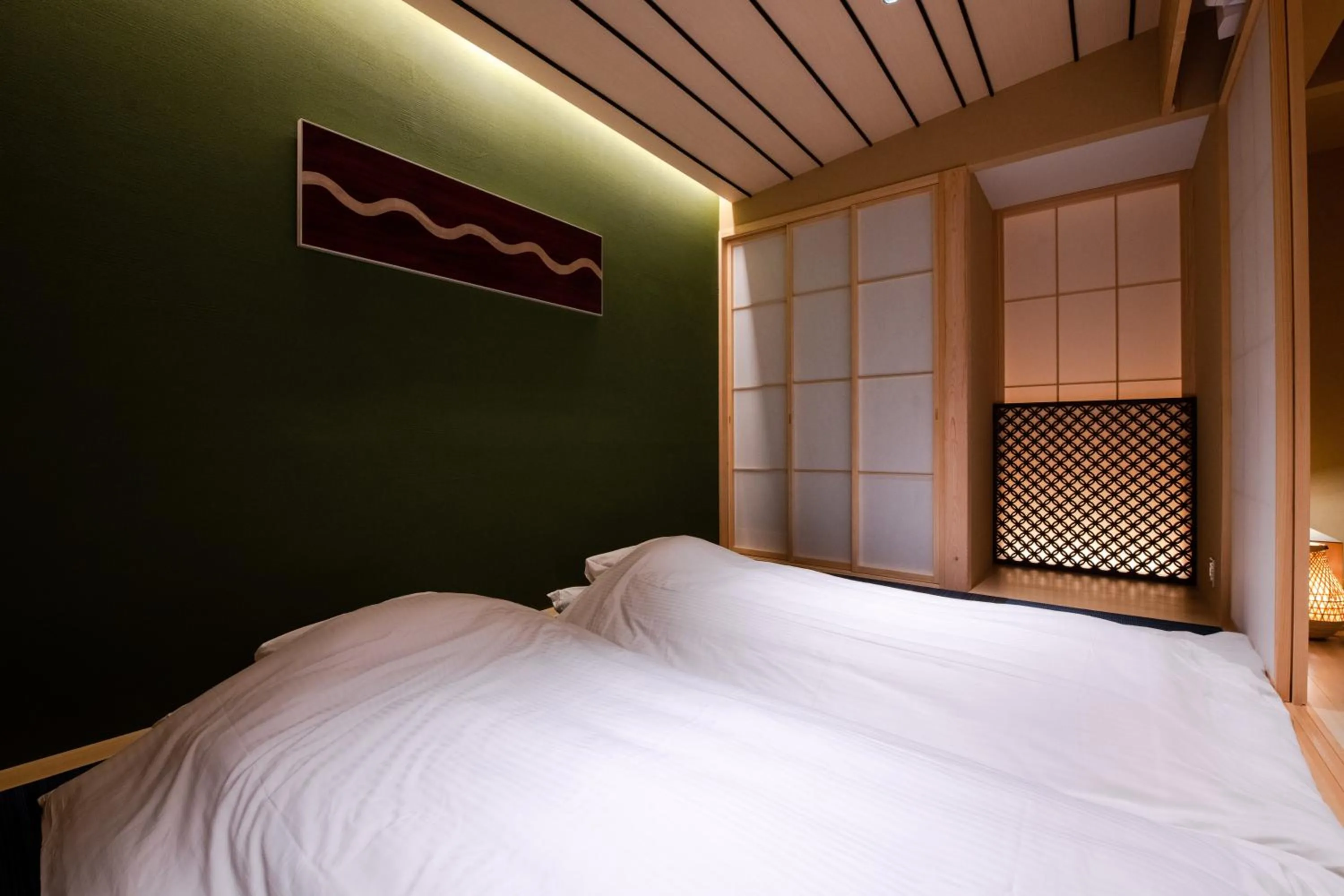 Bed in GuestHouse MIYABI Premium