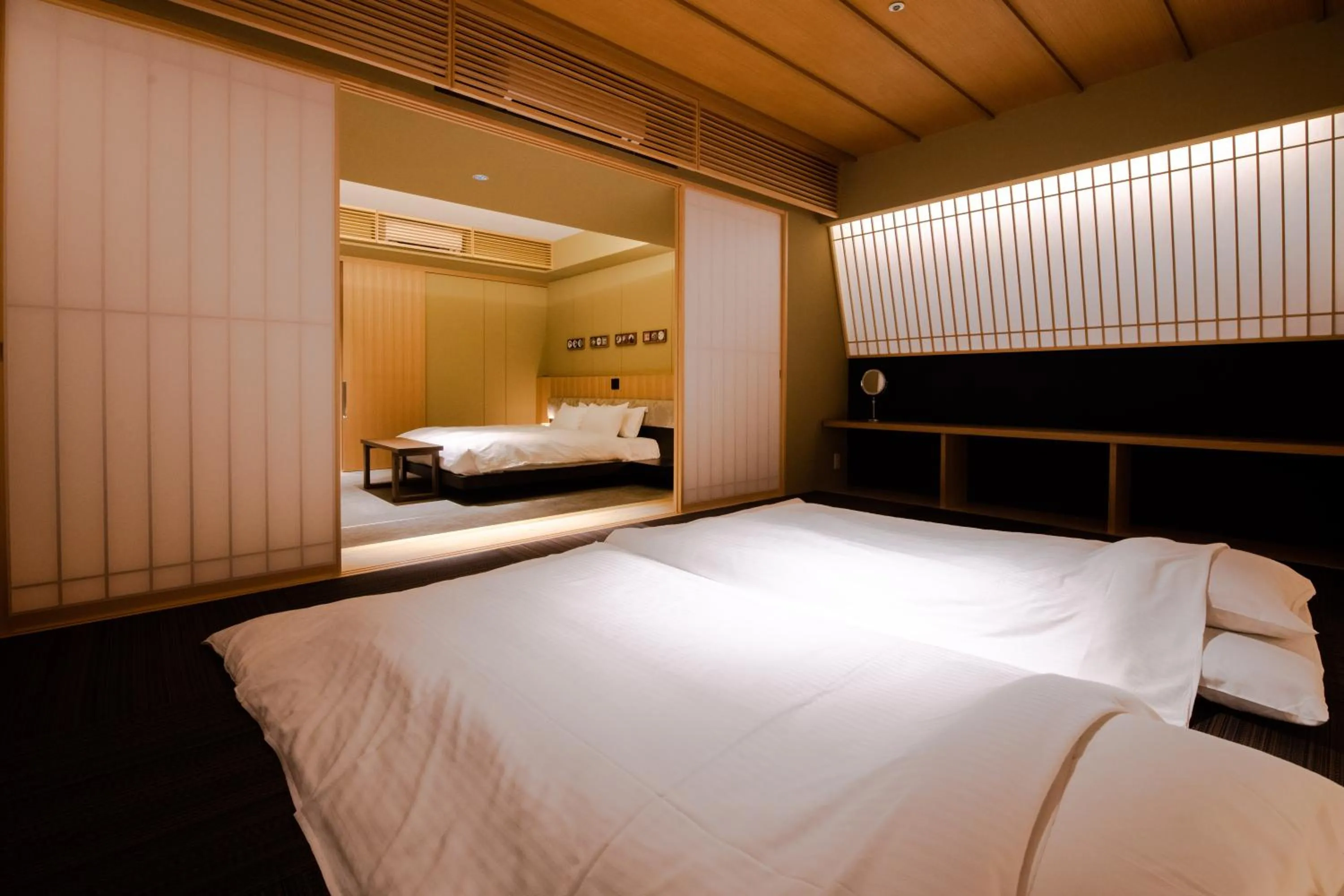 Bed in GuestHouse MIYABI Premium