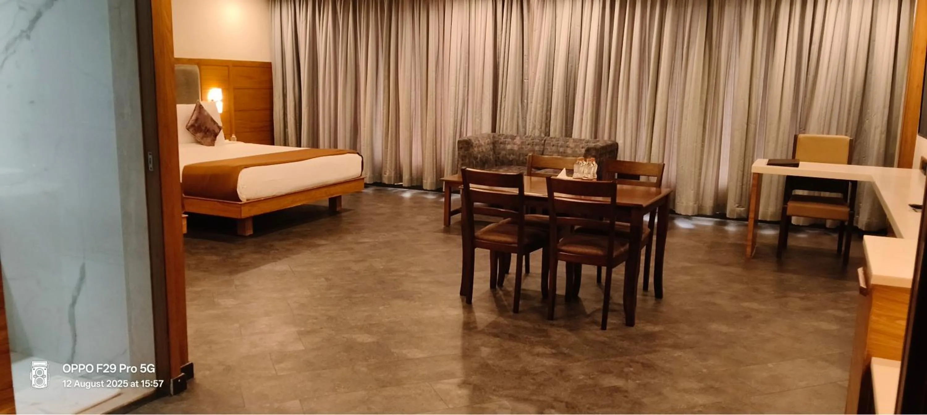 Seating area, Bed in Royal Ritis Hubballi
