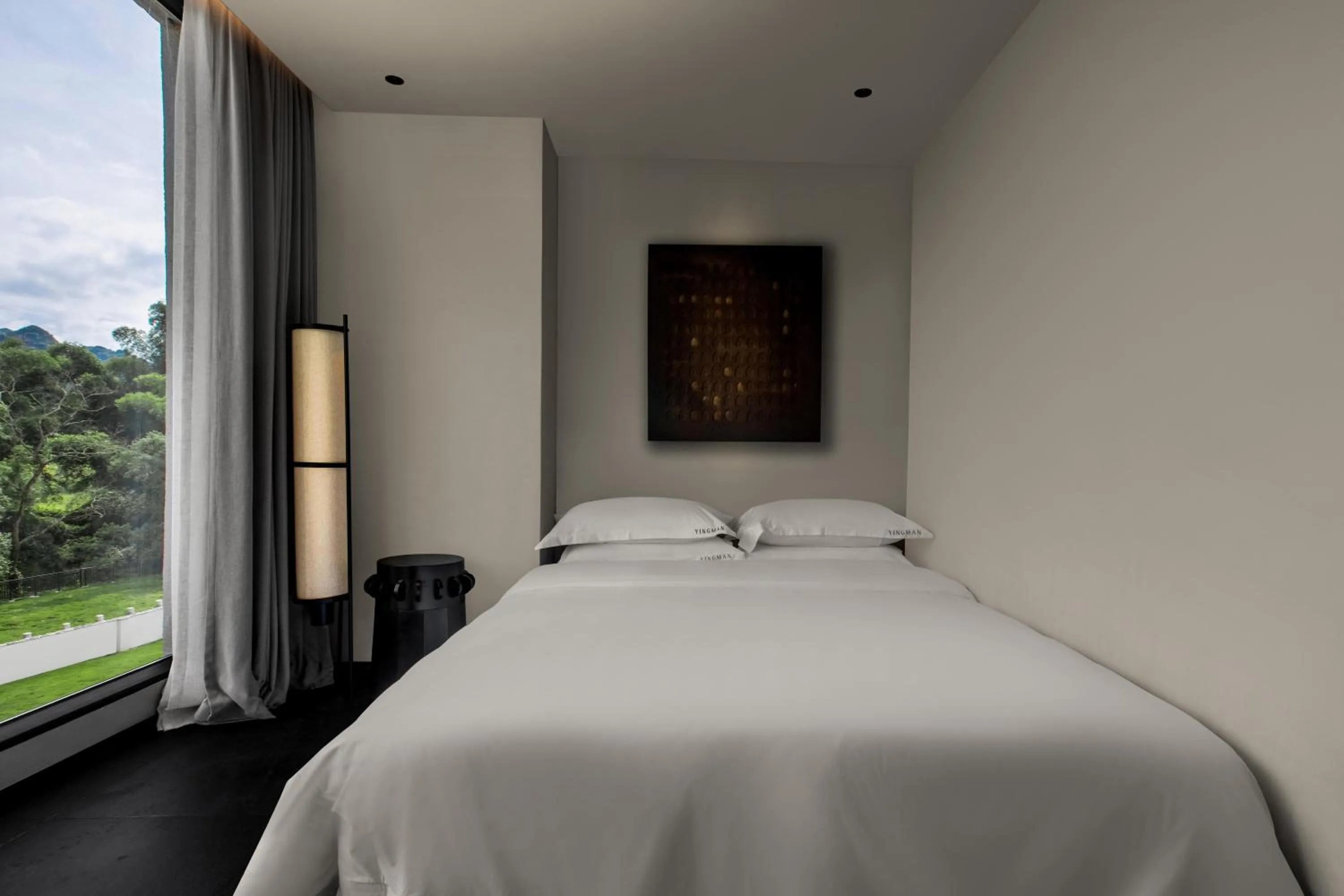 Bed in YINGMAN HOTEL