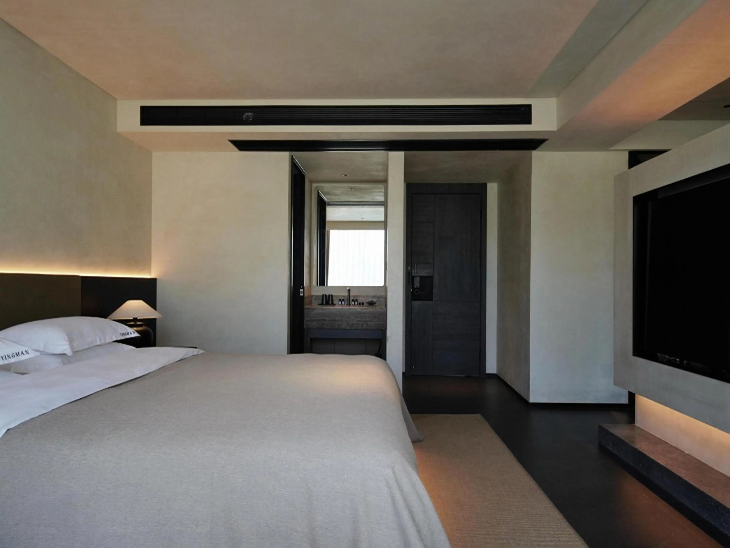 Bed in YINGMAN HOTEL