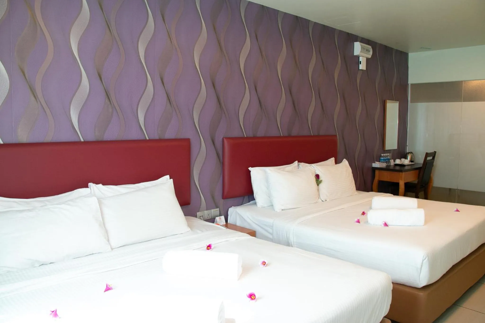 Bed in Prince 33 Hotel