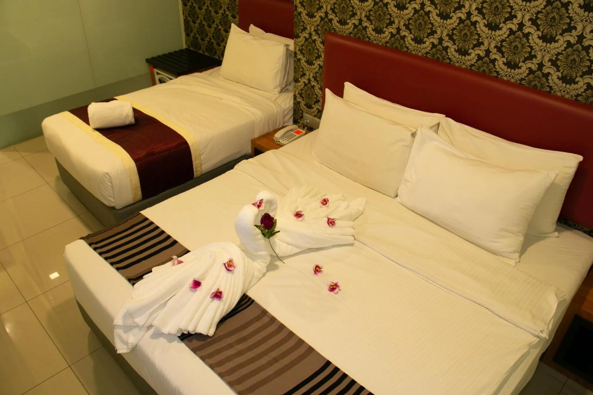 Bed in Prince 33 Hotel