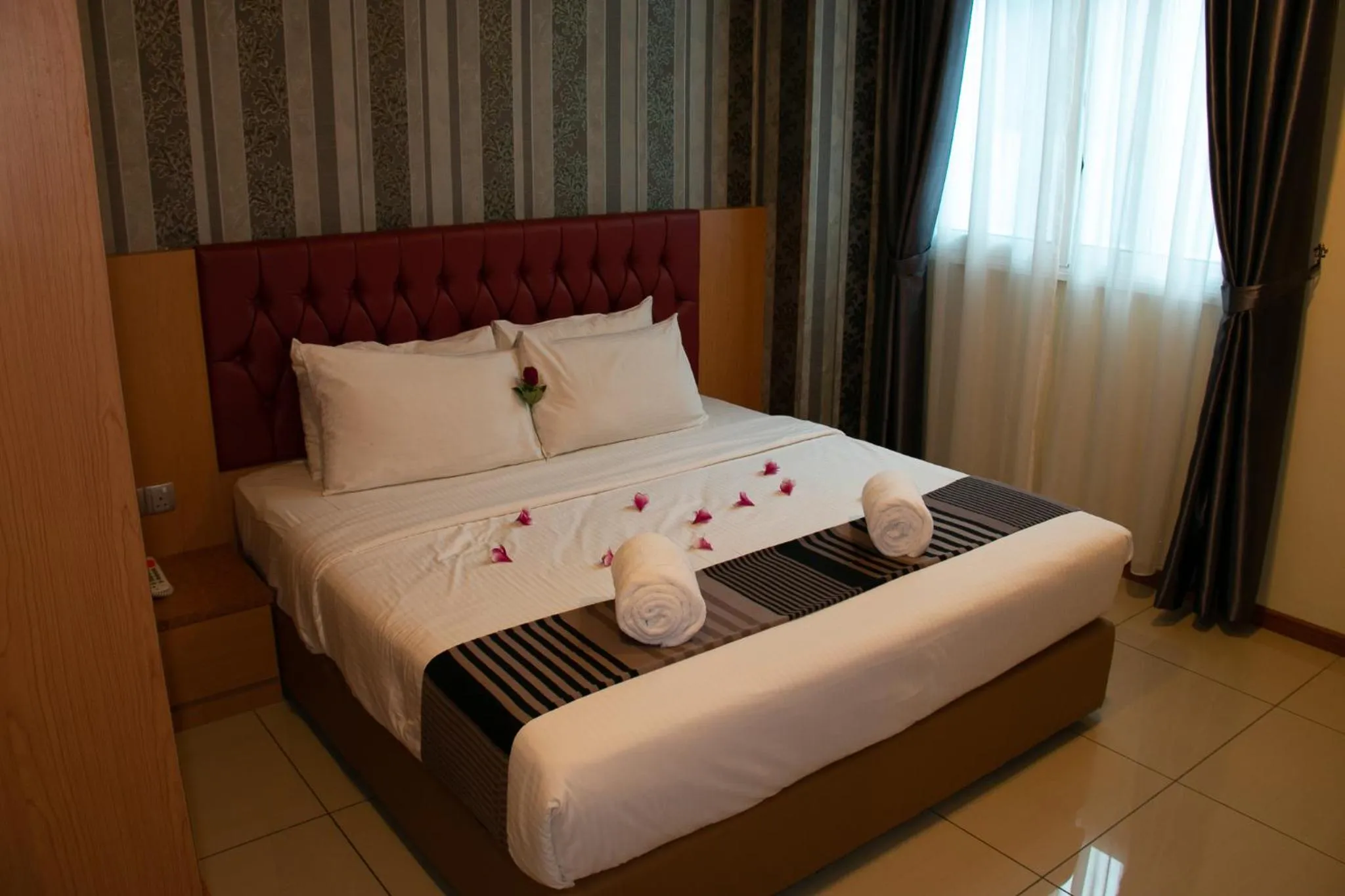 Bed in Prince 33 Hotel