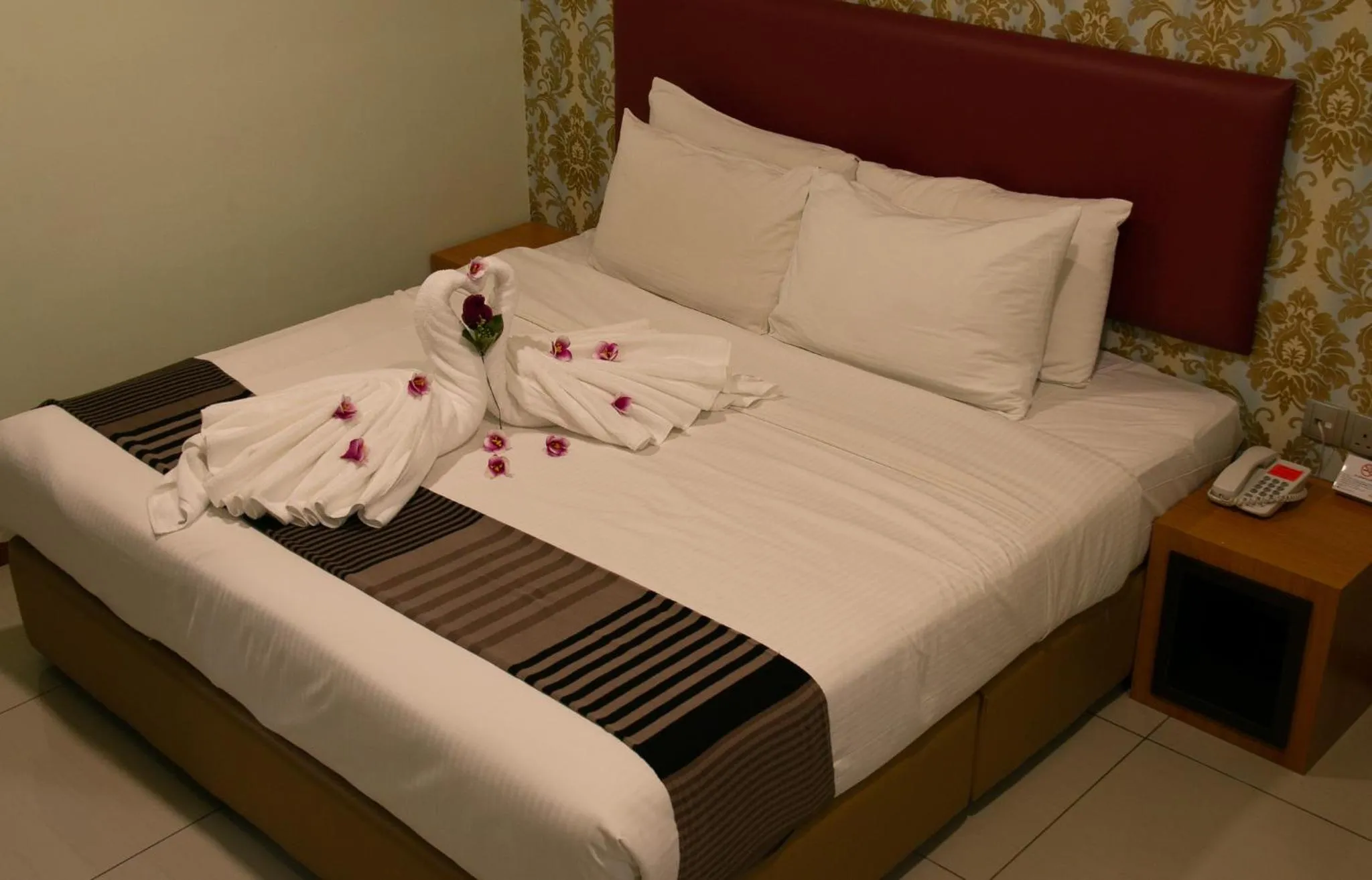 Bed in Prince 33 Hotel