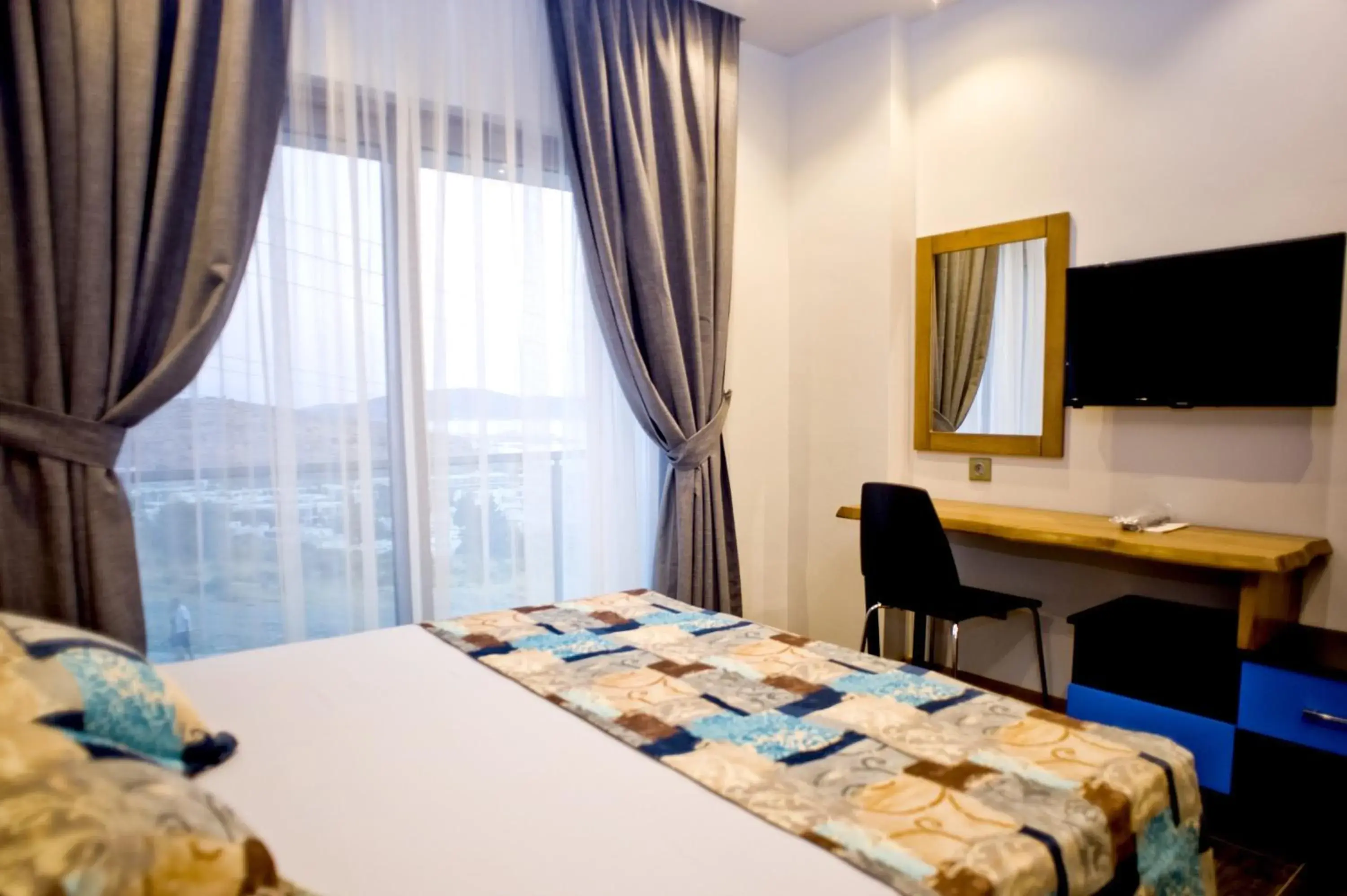 Bed in Degirmenburnu Residence Bed in Degirmenburnu Residence