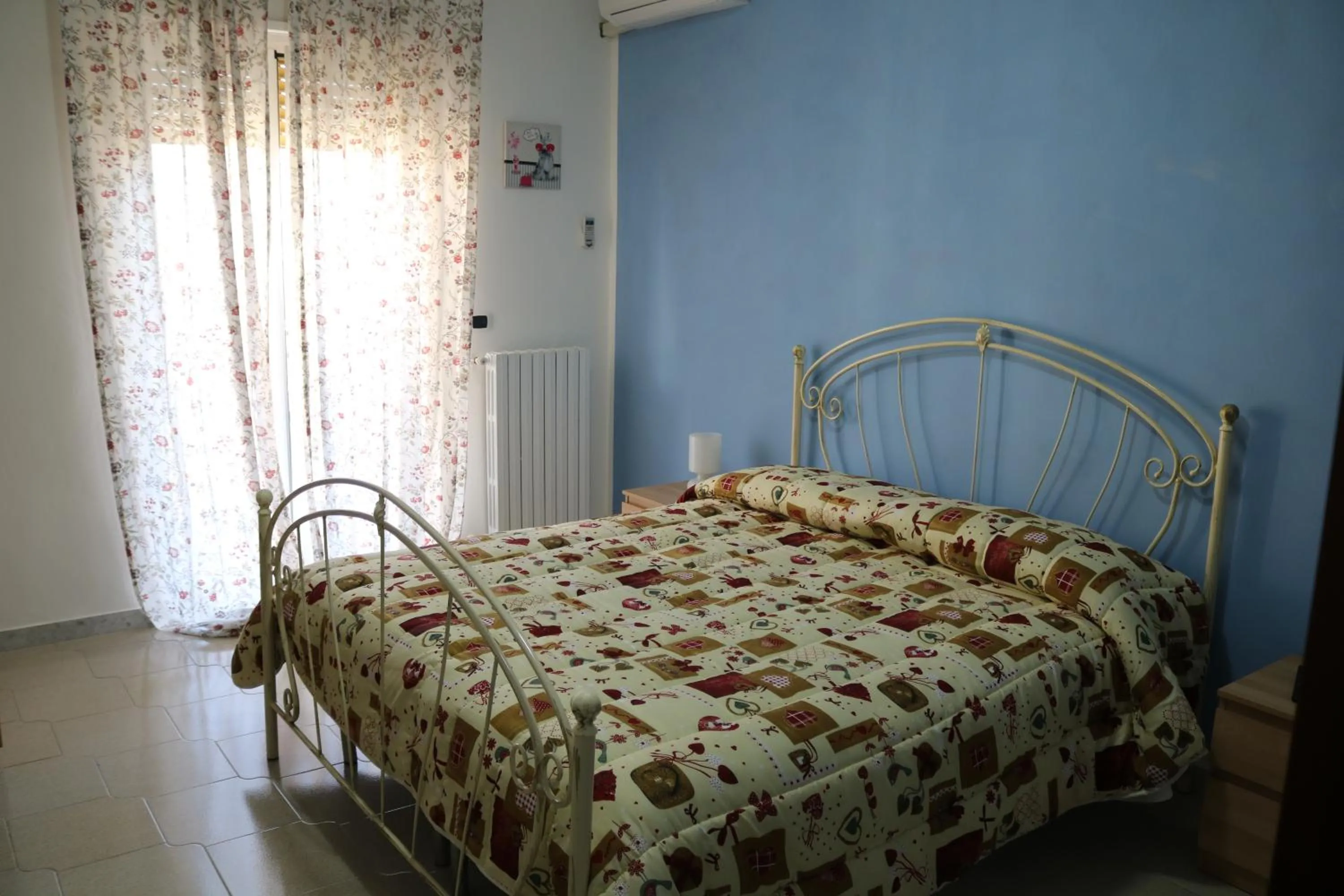 Bed in Le Tre Rose Bed & Breakfast