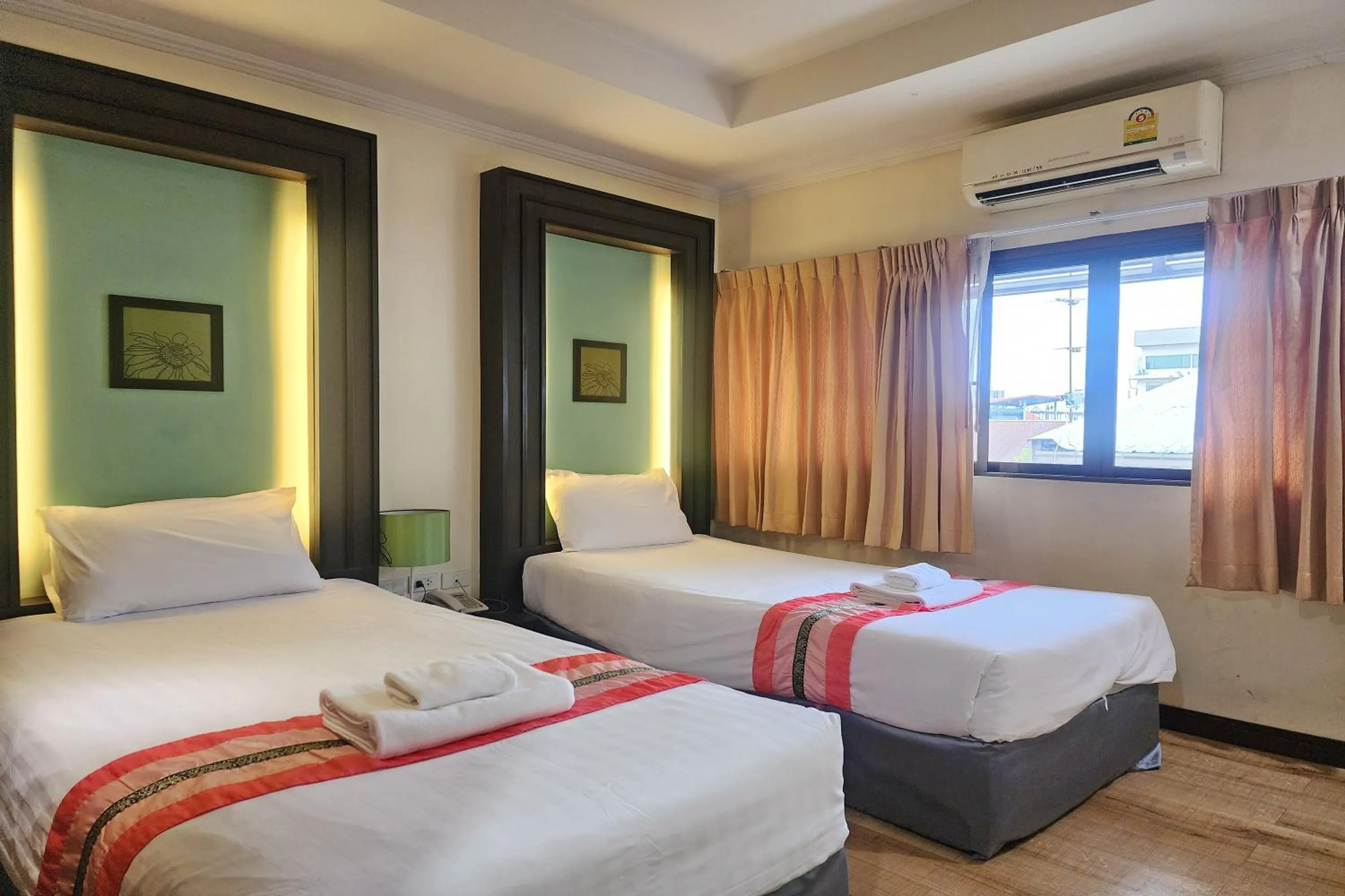 Bed in Suan Sunandha Palace Hotel