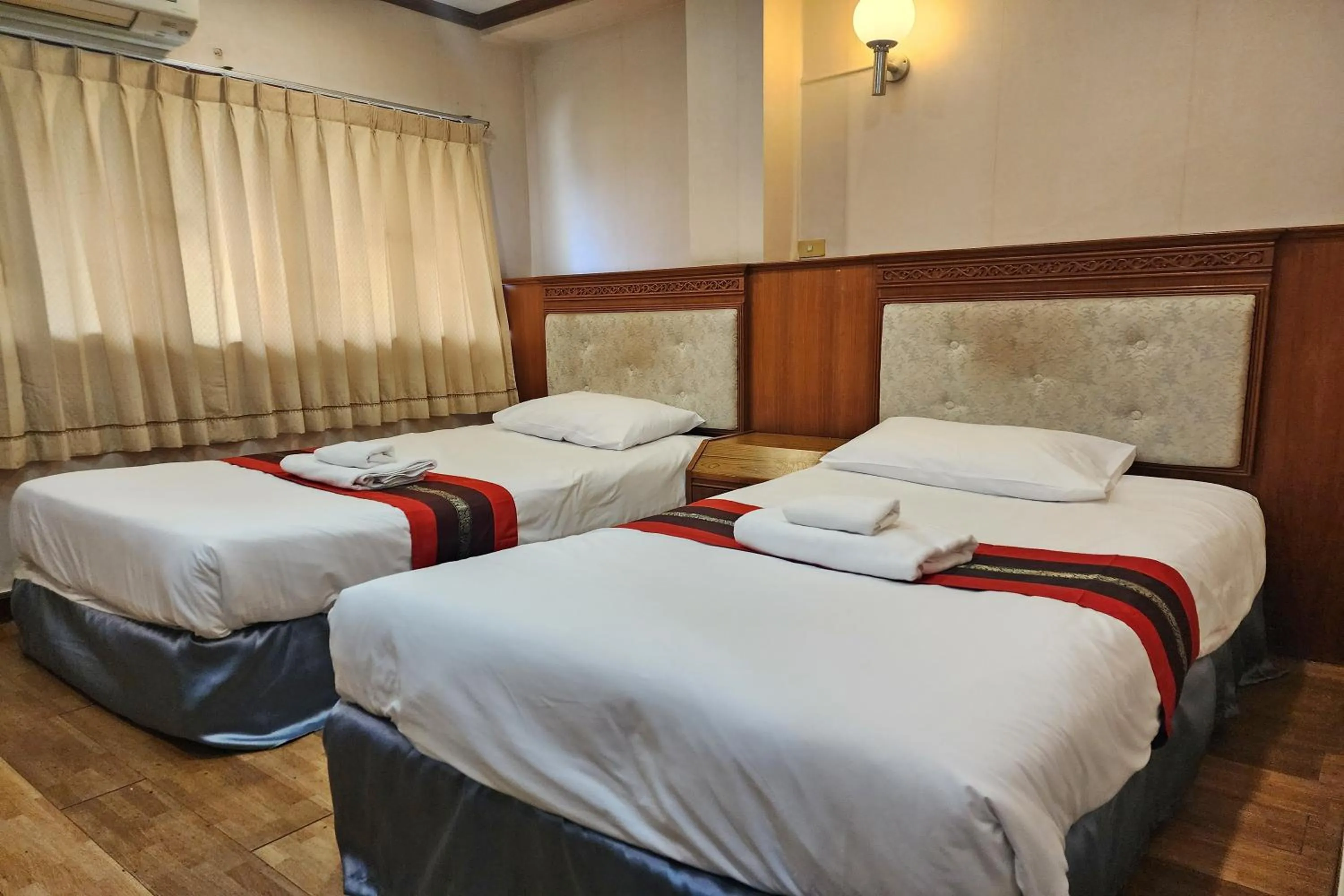 Bed in Suan Sunandha Palace Hotel