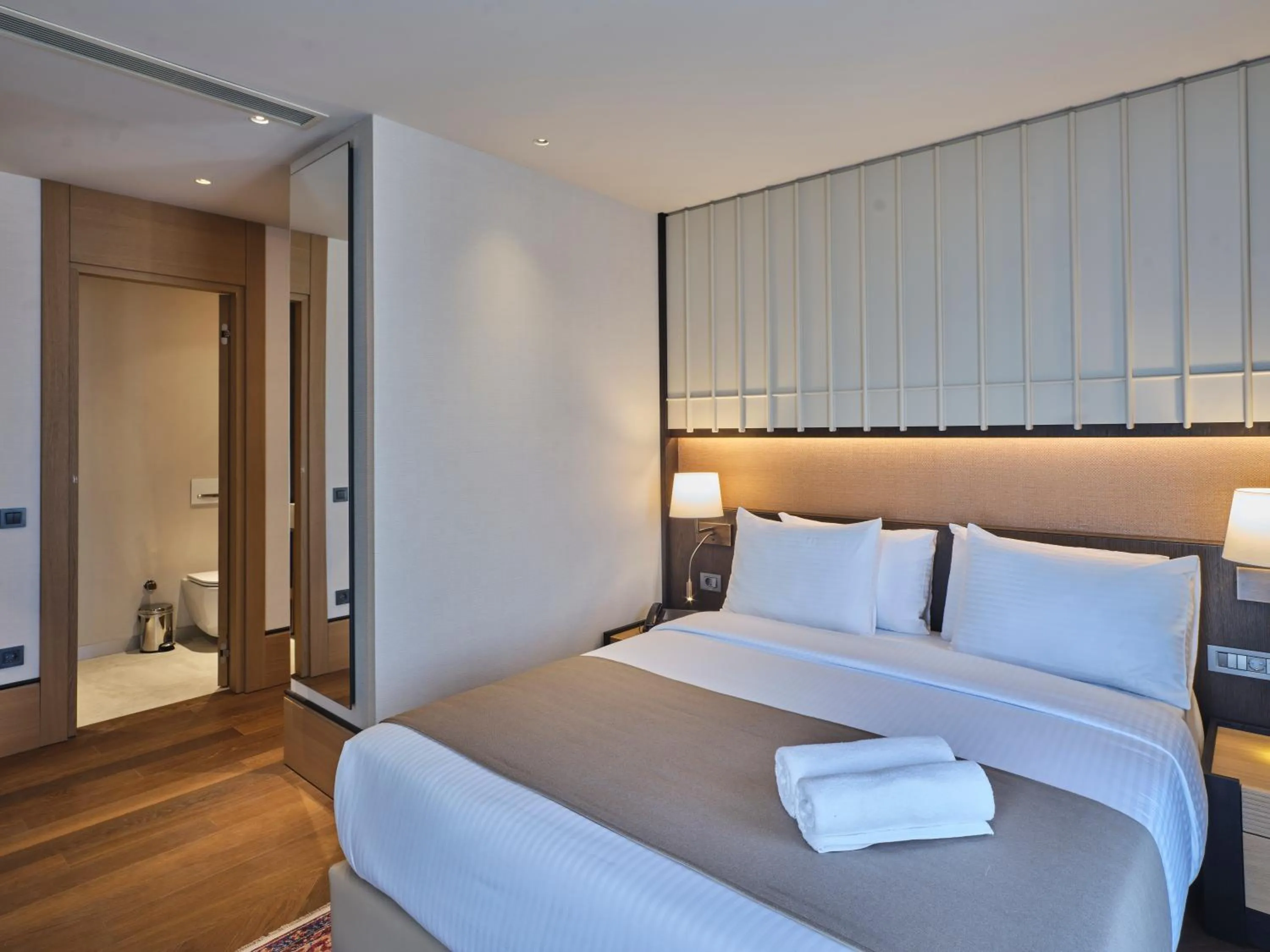 Bed in Four-G Hotel Premium