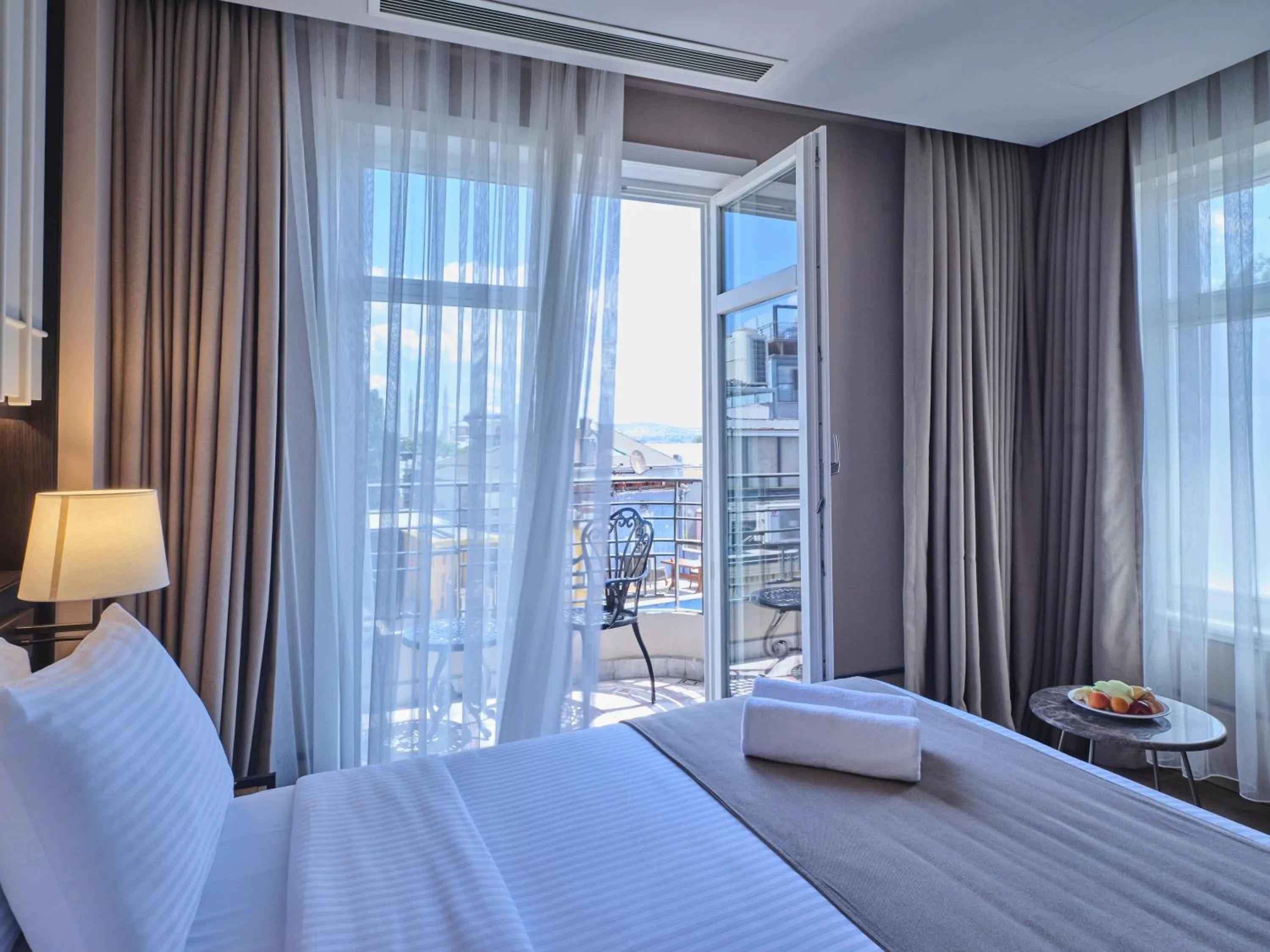 Bed in Four-G Hotel Premium