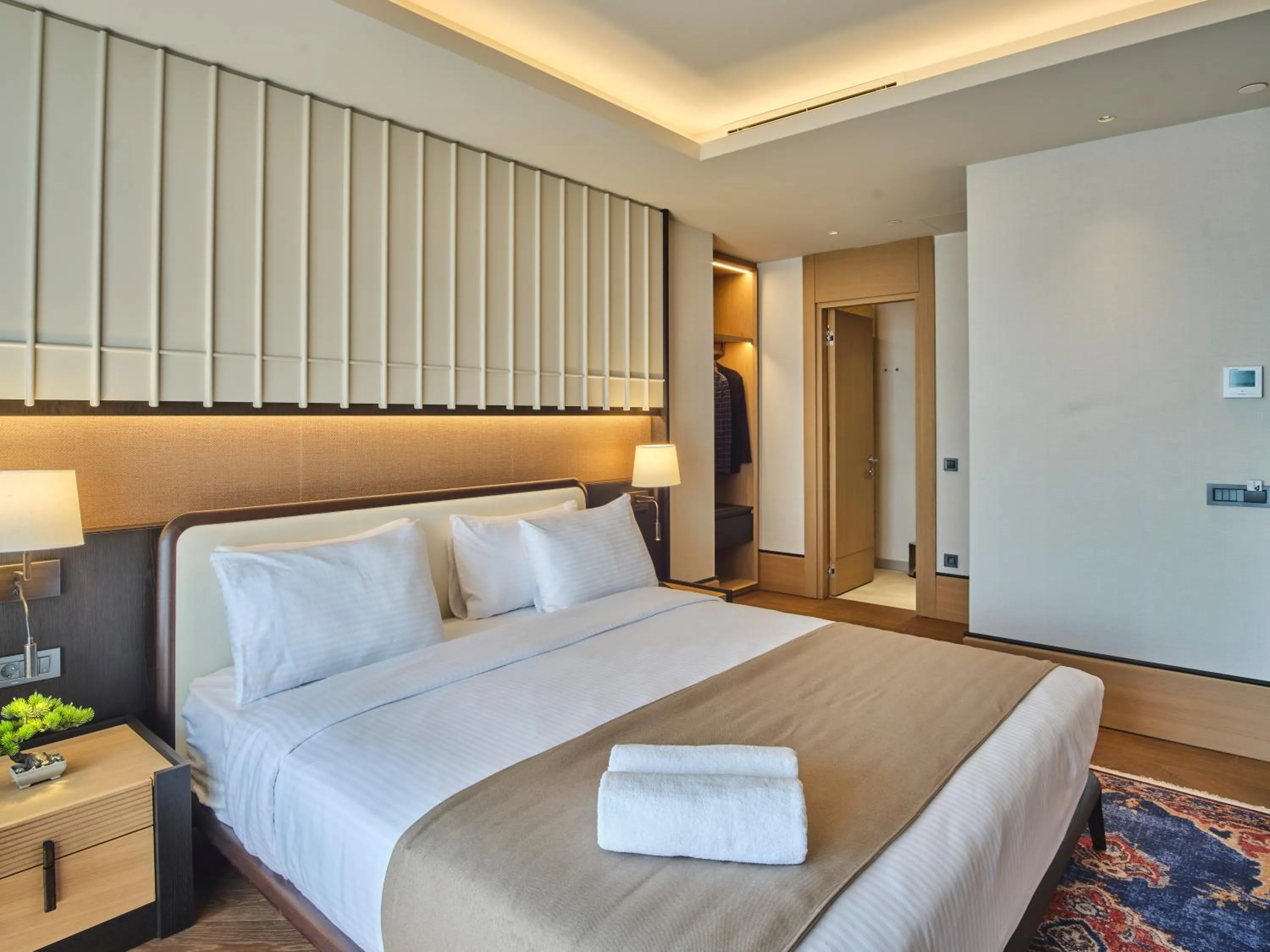Bed in Four-G Hotel Premium