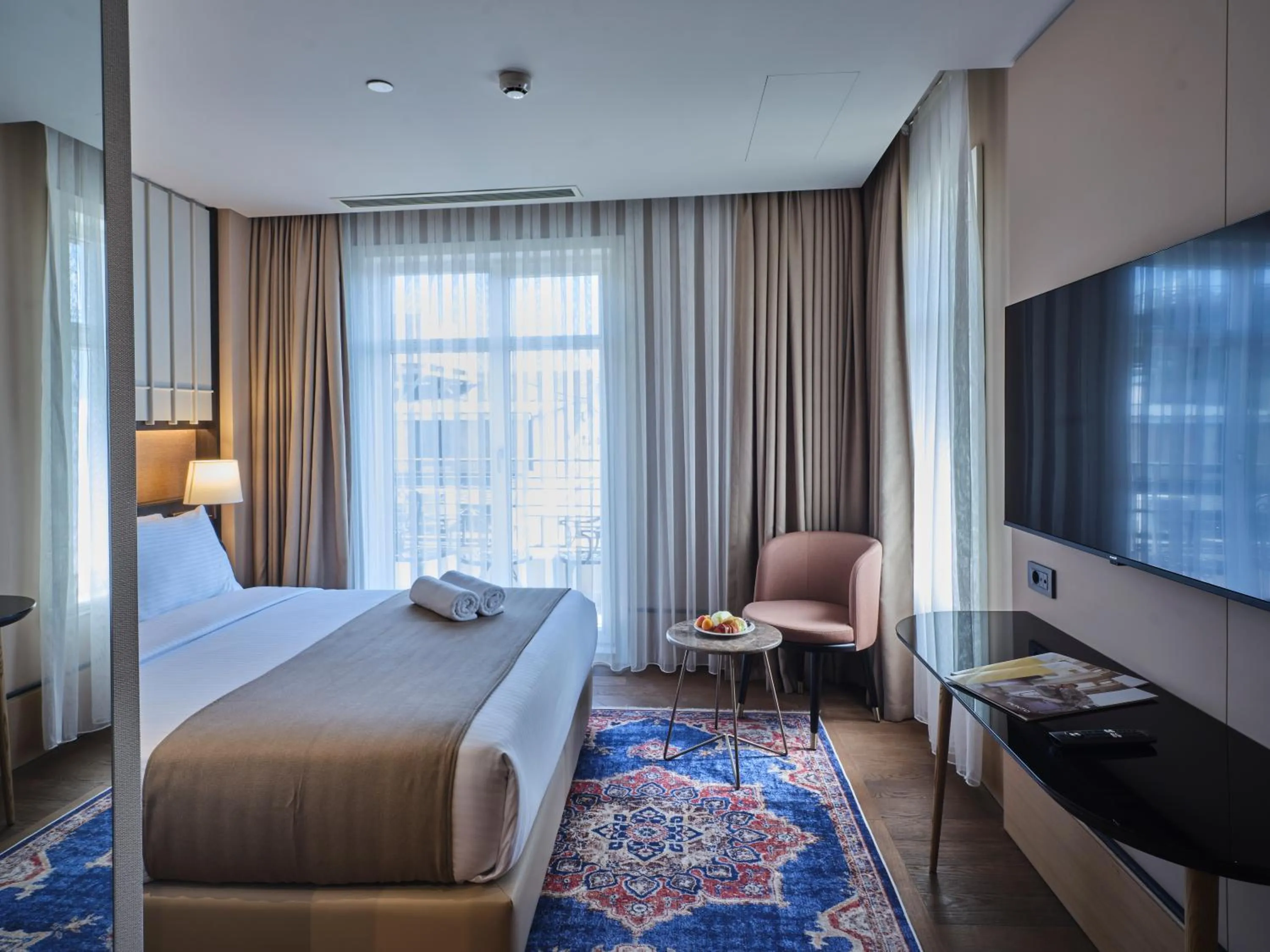 Bed in Four-G Hotel Premium