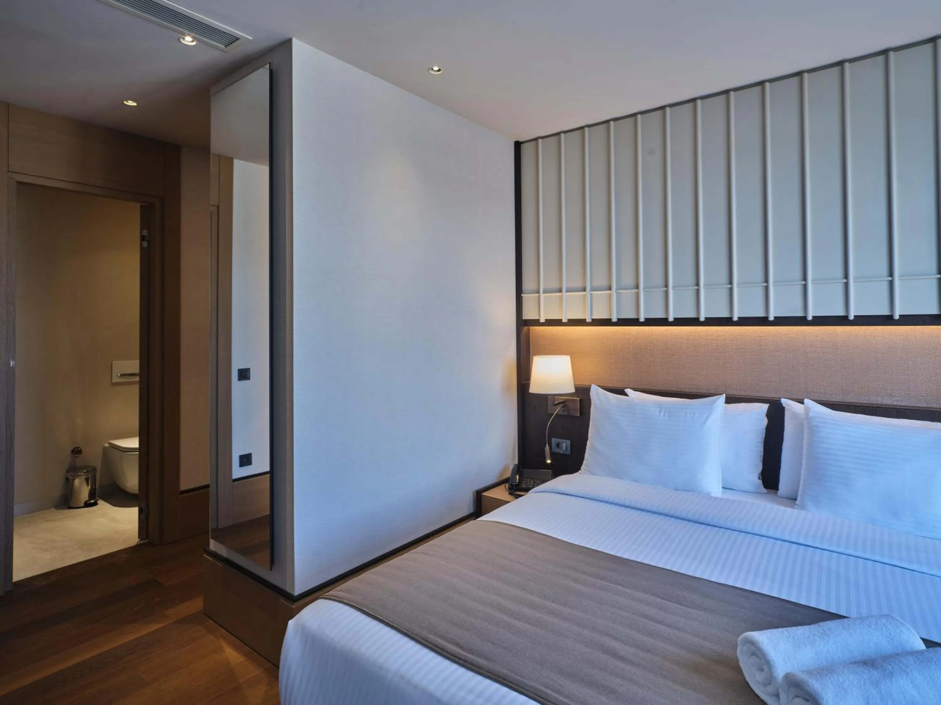 Bed in Four-G Hotel Premium