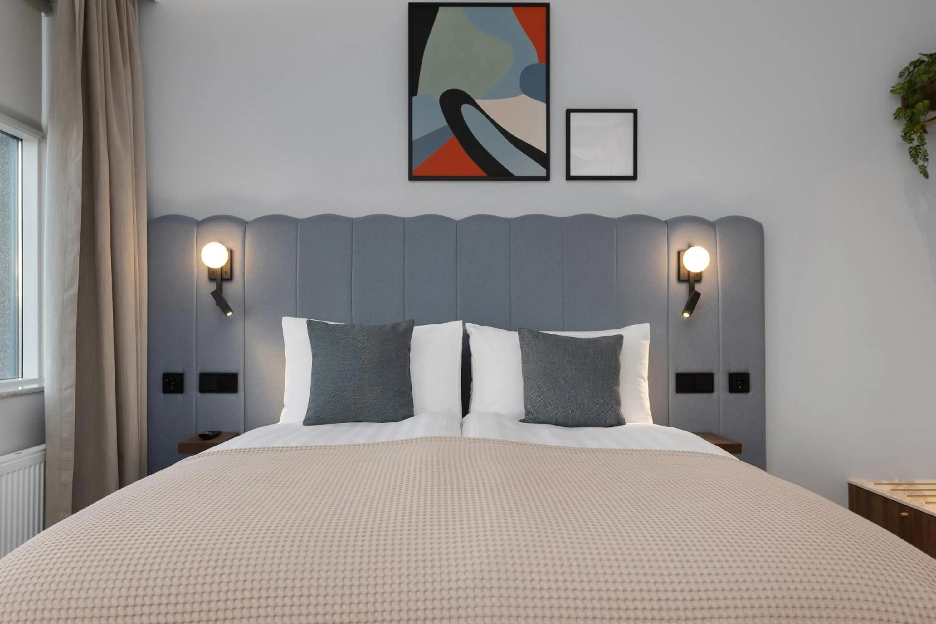 Bed in Candlewood Suites Reykjavik by IHG