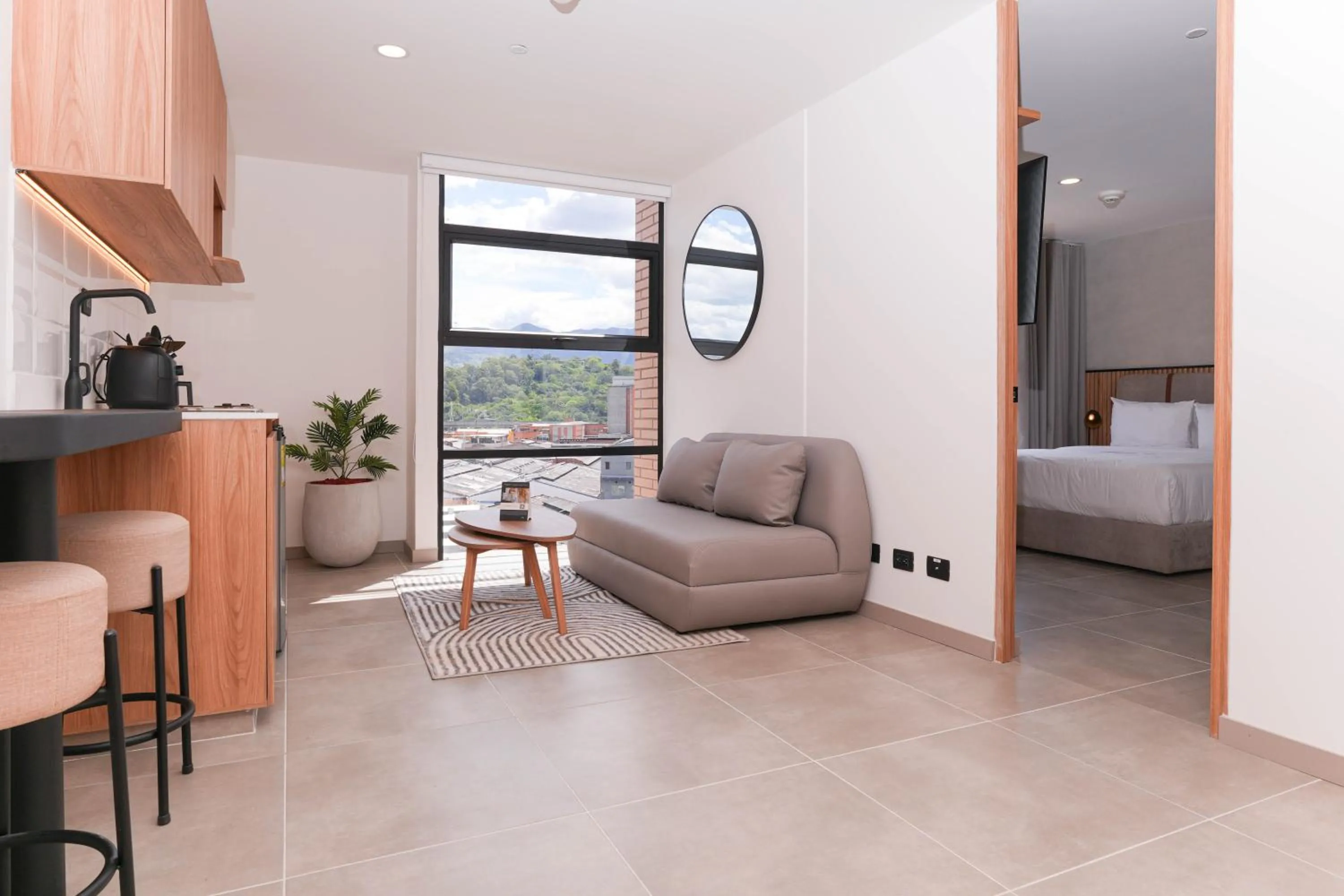 Living room, Bed in Metropolitan Living Medellín by HOUSY