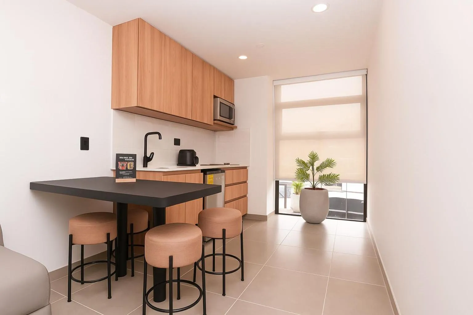 Kitchen or kitchenette in Metropolitan Living Medellín by HOUSY