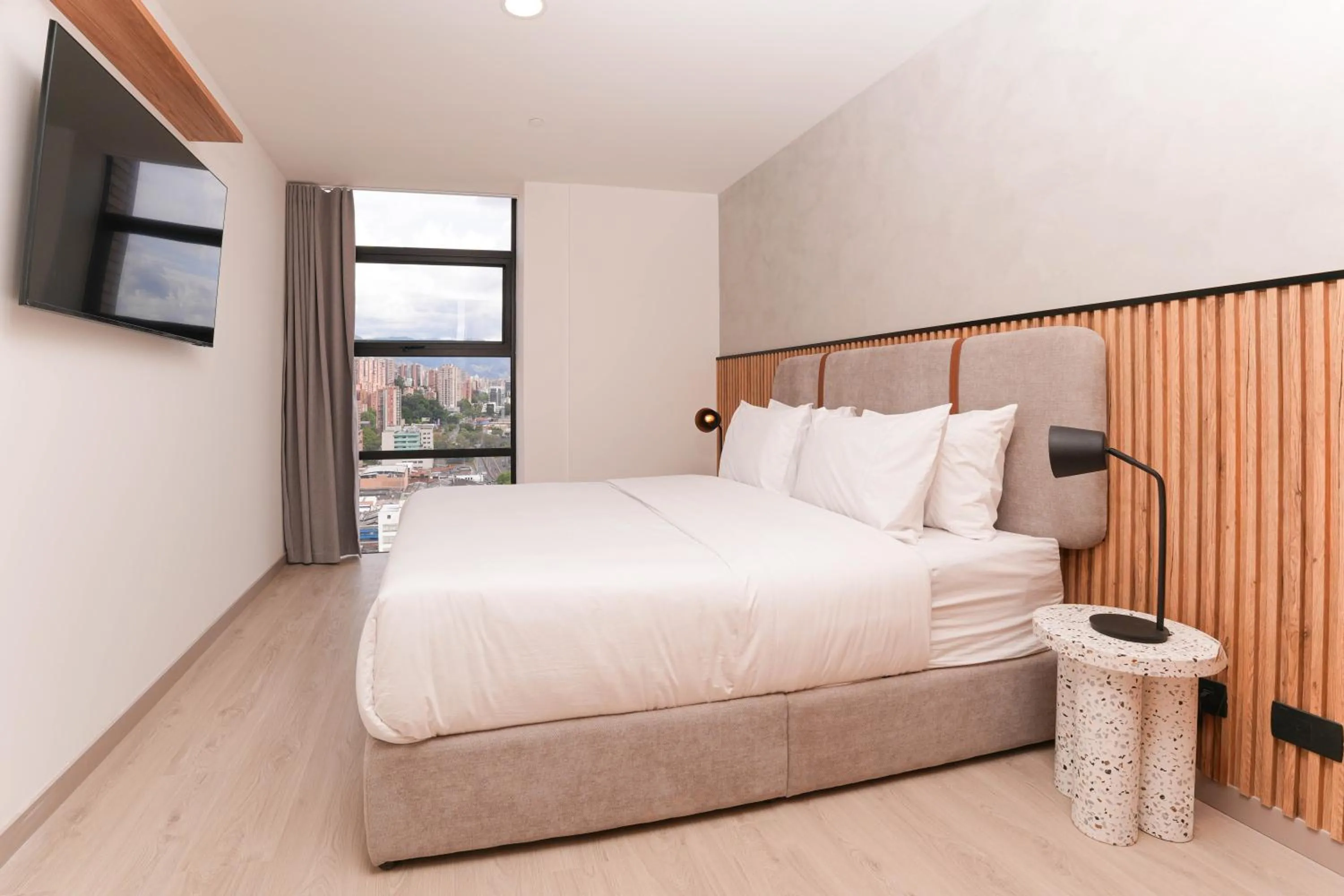 Photo of the whole room, Bed in Metropolitan Living Medellín by HOUSY
