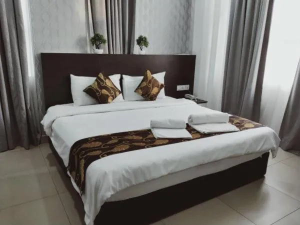 Bed in D'Metro Hotel