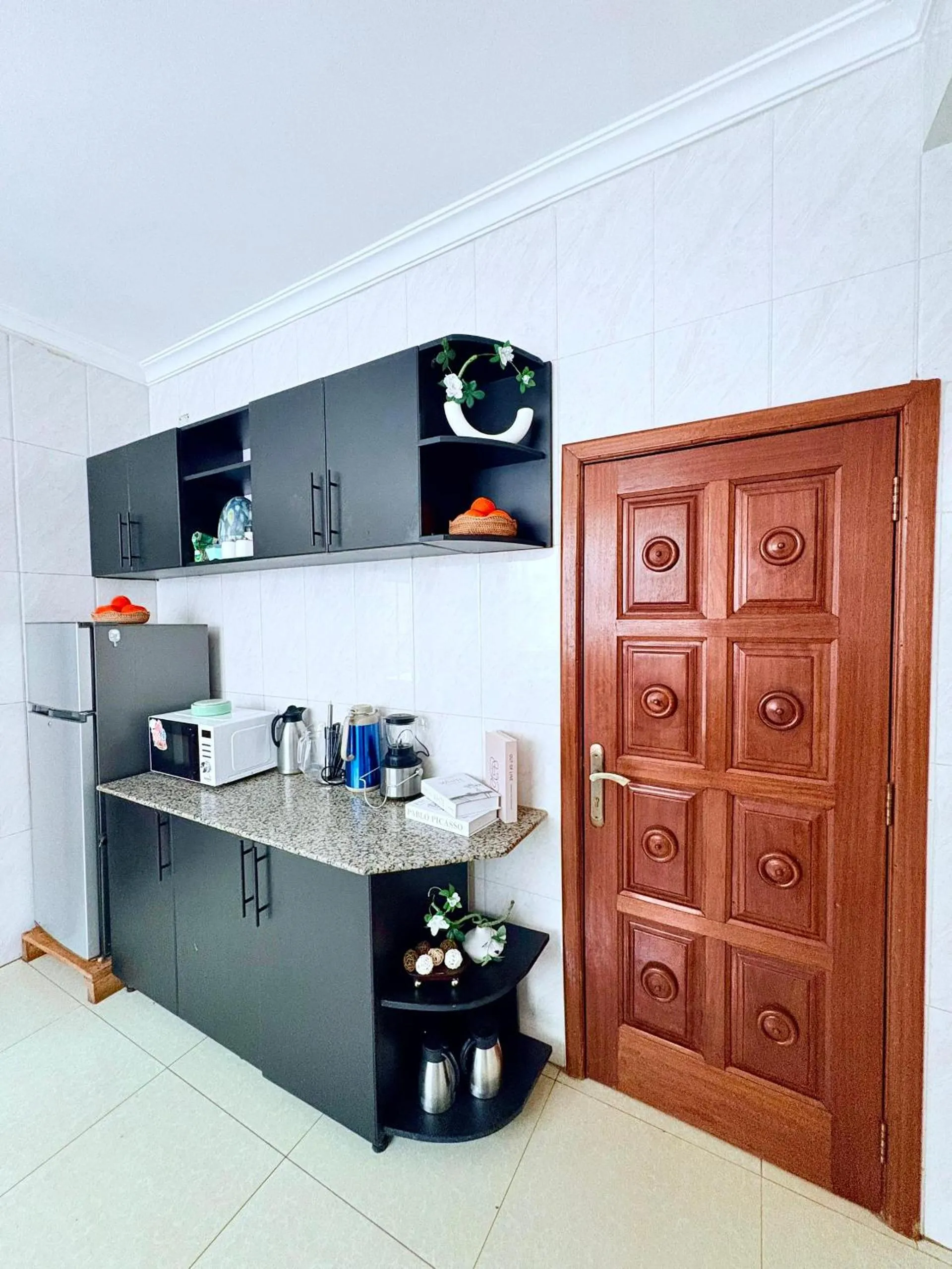 Kitchen or kitchenette in kigali Pillar House inn