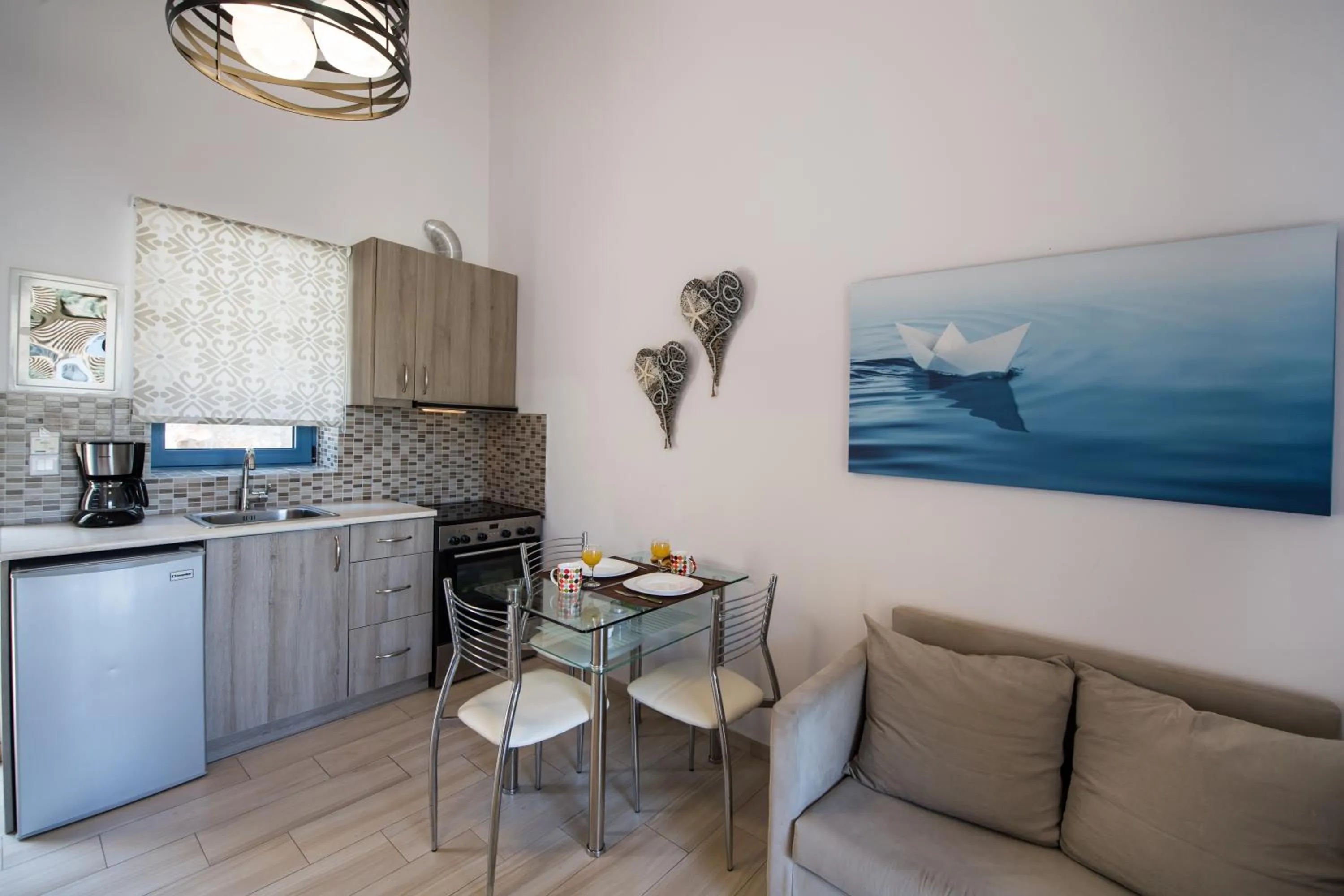 Kitchen or kitchenette in Ilianthos Apartments & Rooms