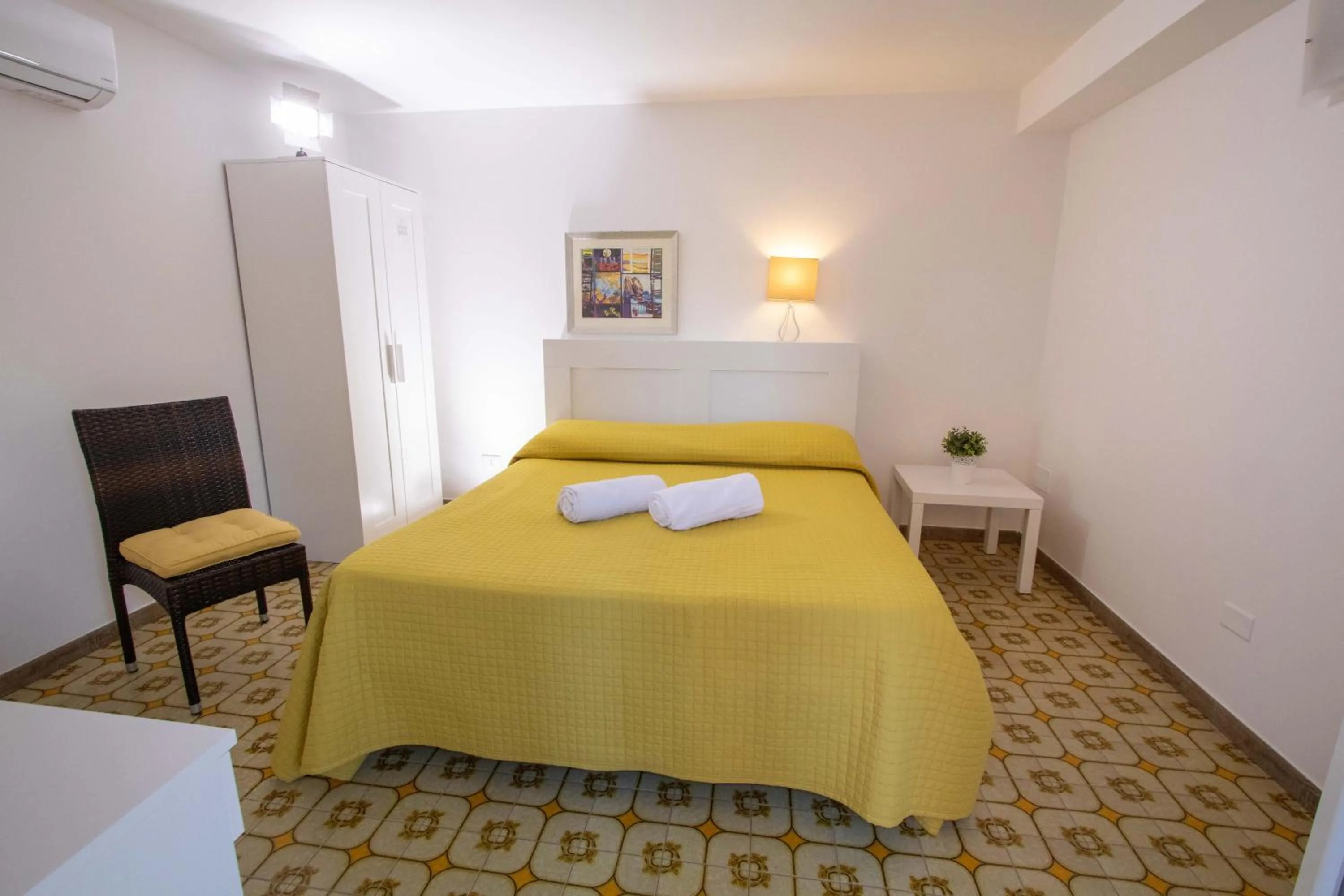 Bedroom, Bed in Le Torrette Rooms and Apartments
