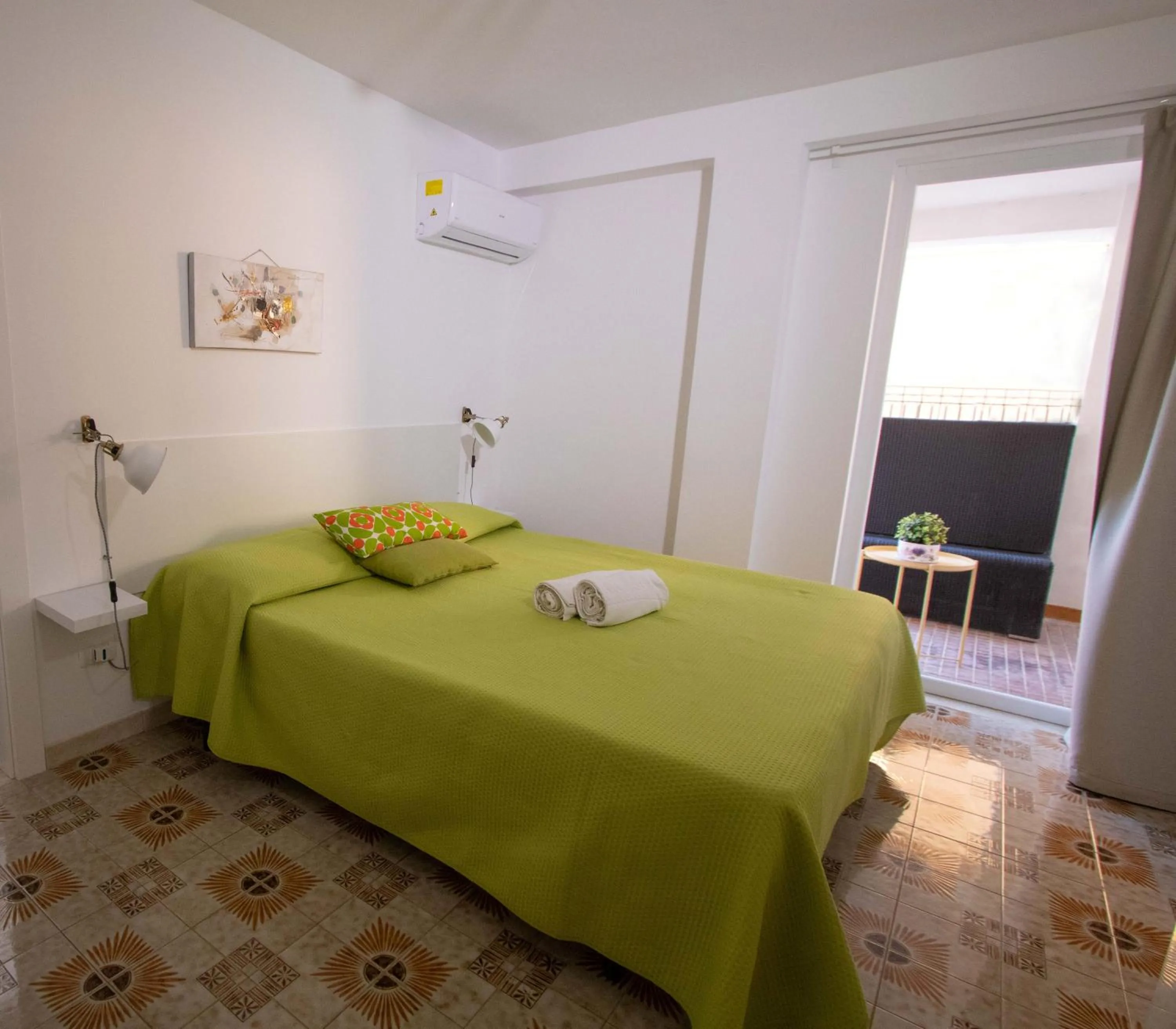 Bedroom, Bed in Le Torrette Rooms and Apartments