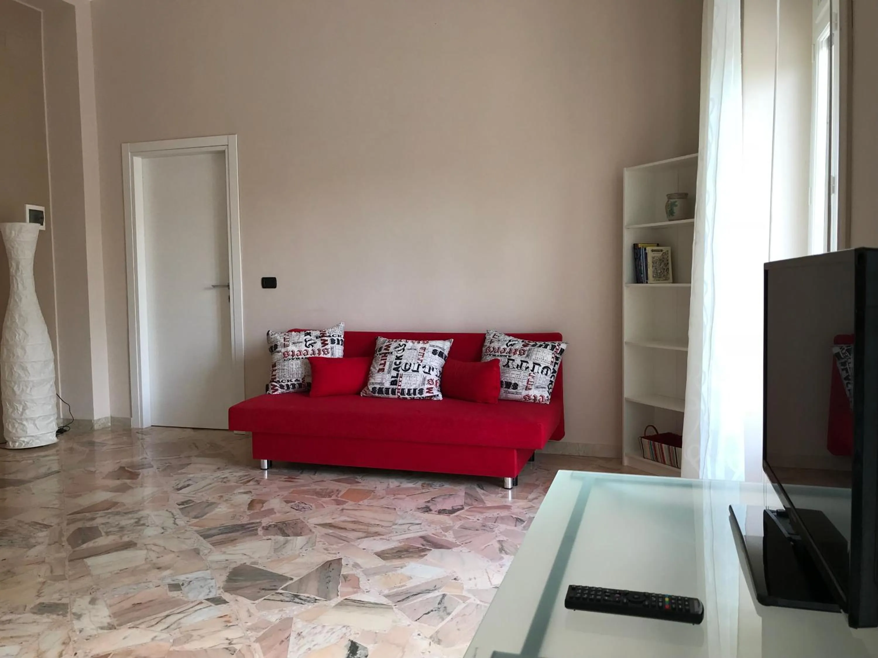 Bed in Le Torrette Rooms and Apartments