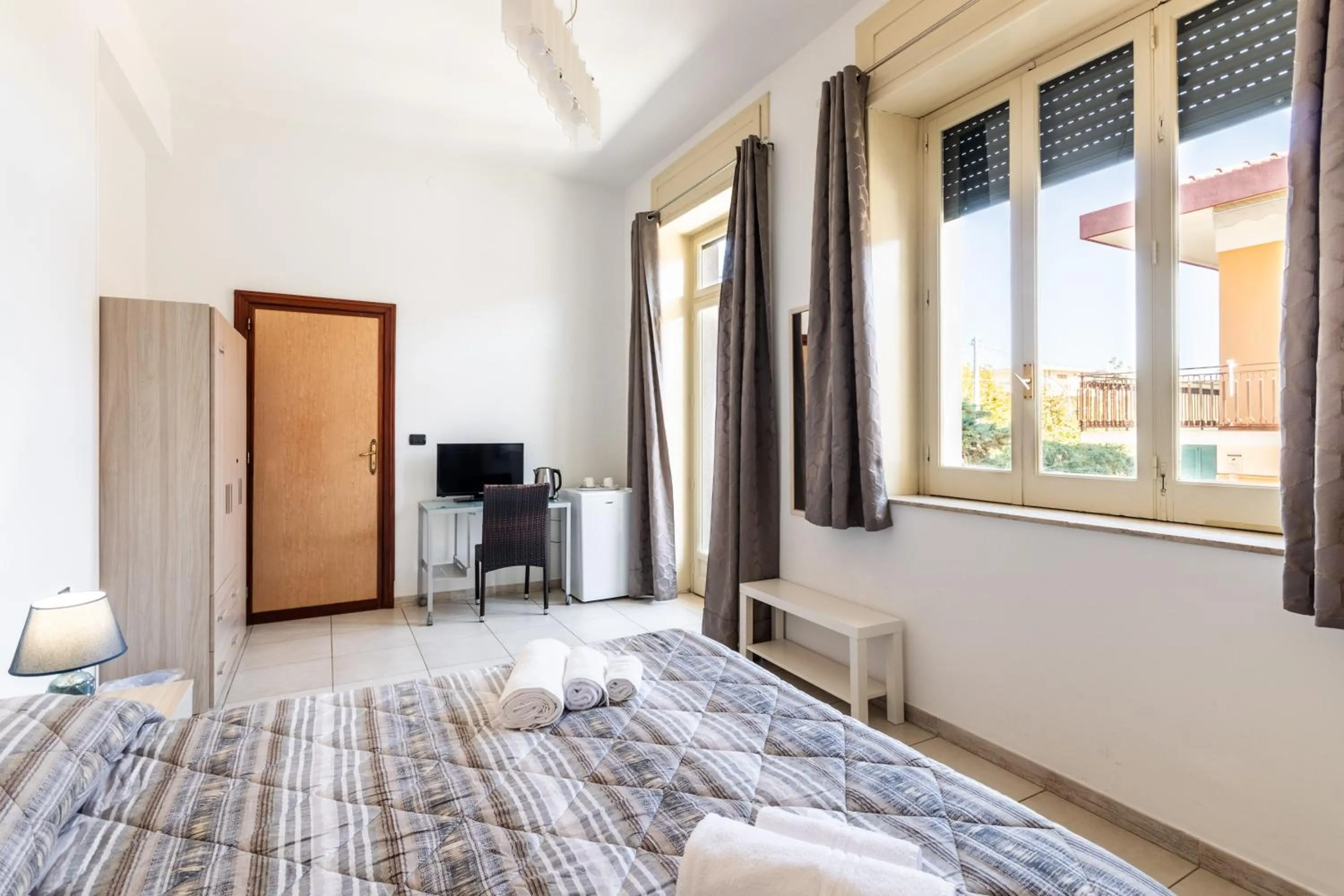 Bedroom, Bed in Le Torrette Rooms and Apartments