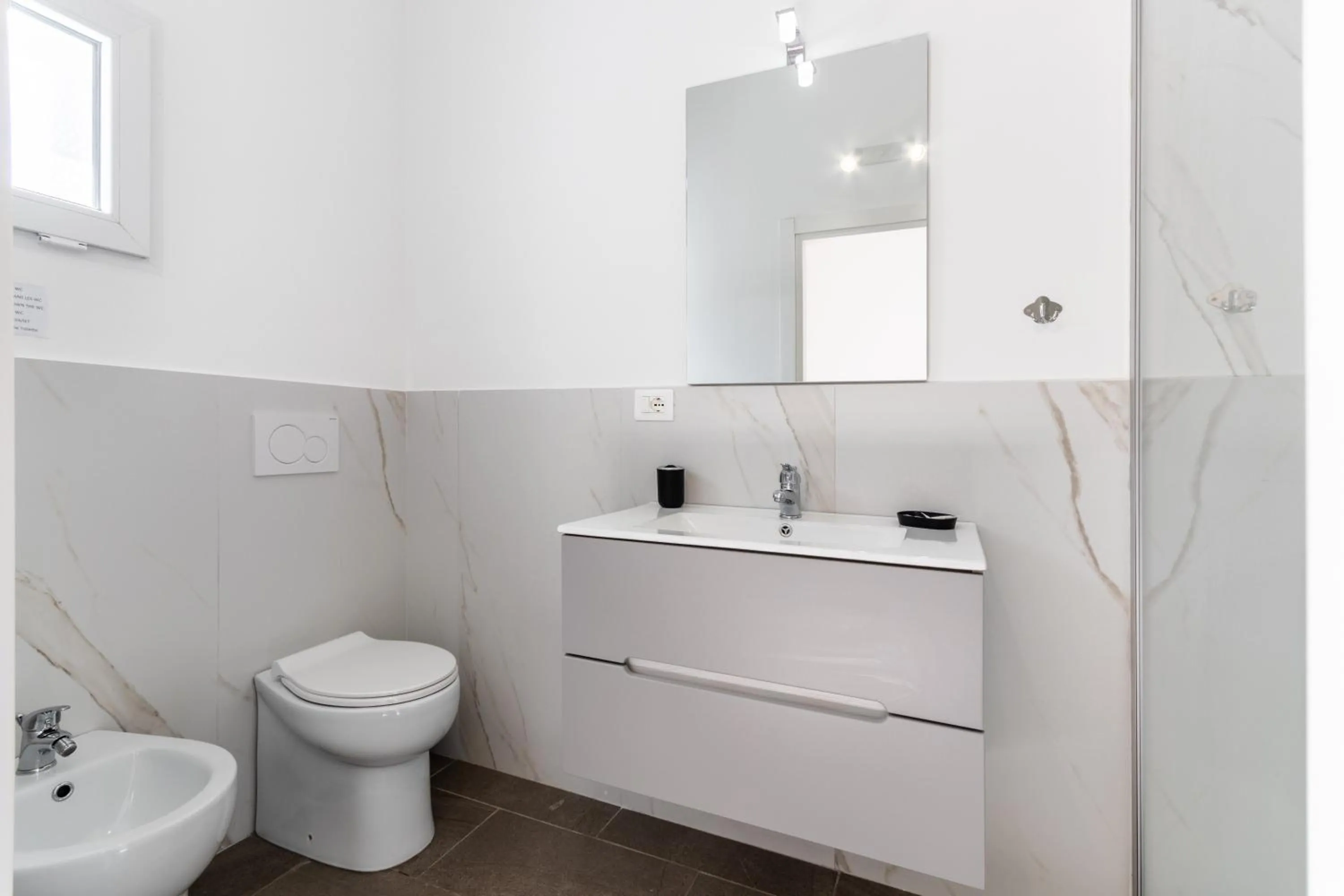 Toilet in Le Torrette Rooms and Apartments