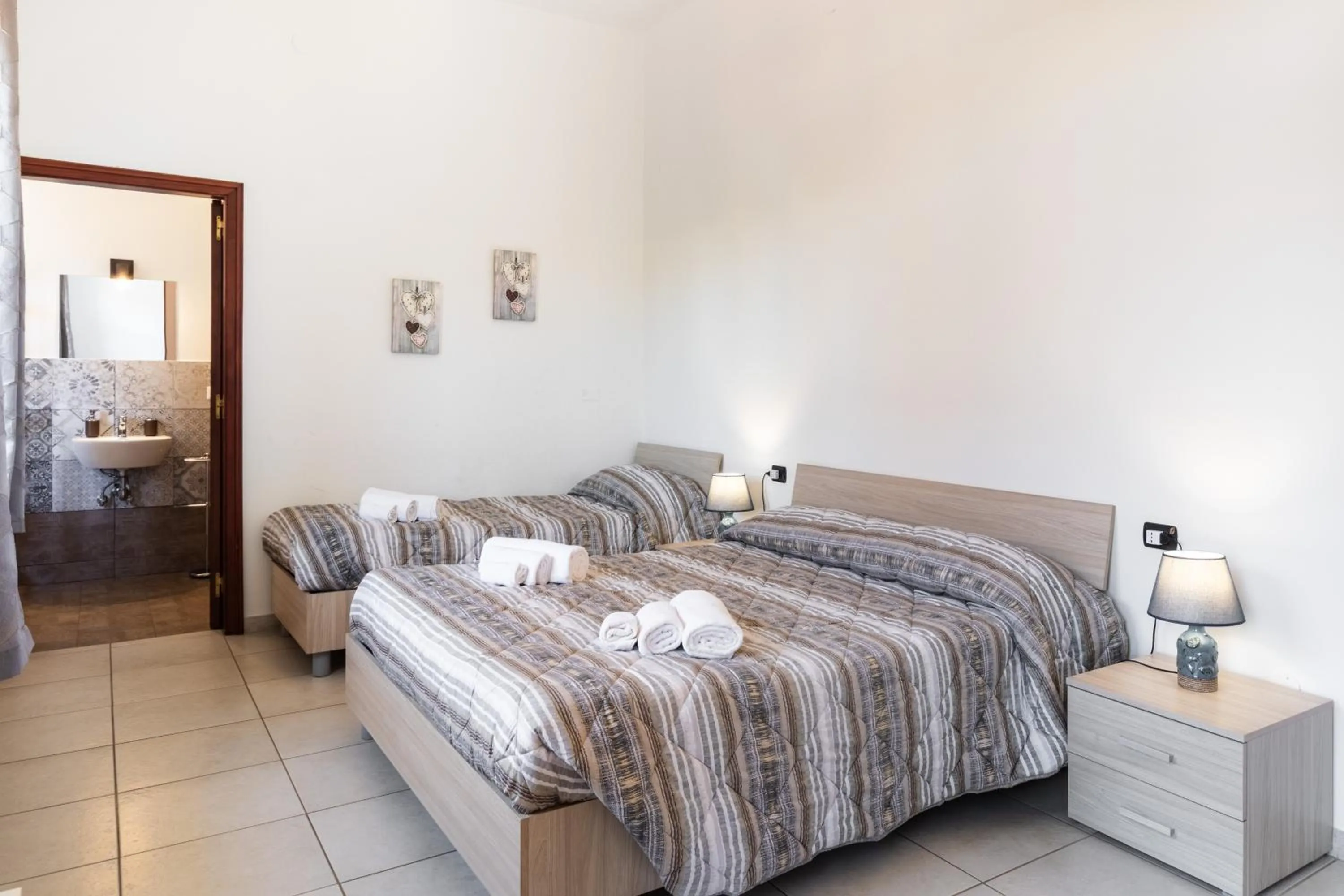 Bedroom, Bed in Le Torrette Rooms and Apartments