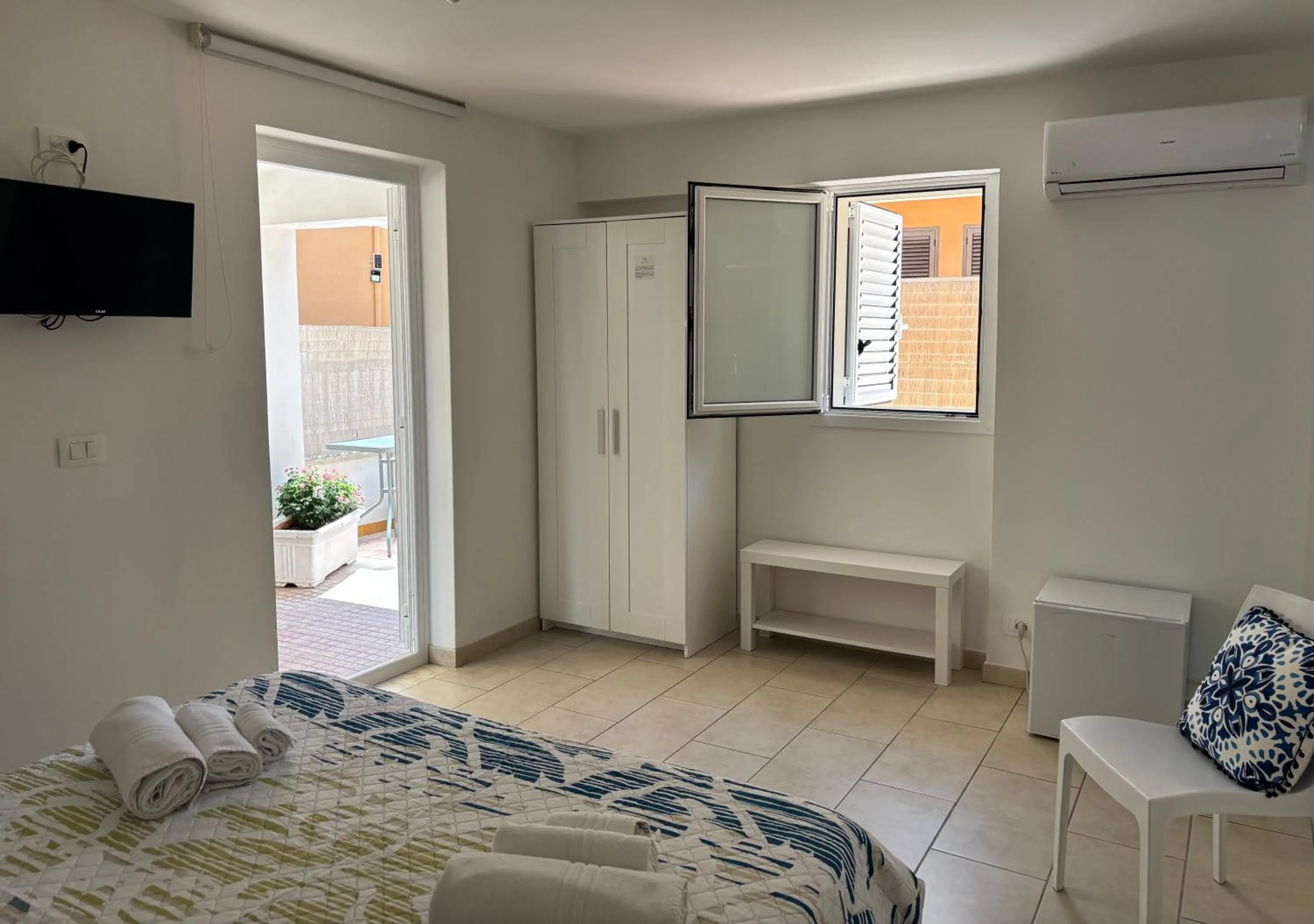 Bed in Le Torrette Rooms and Apartments