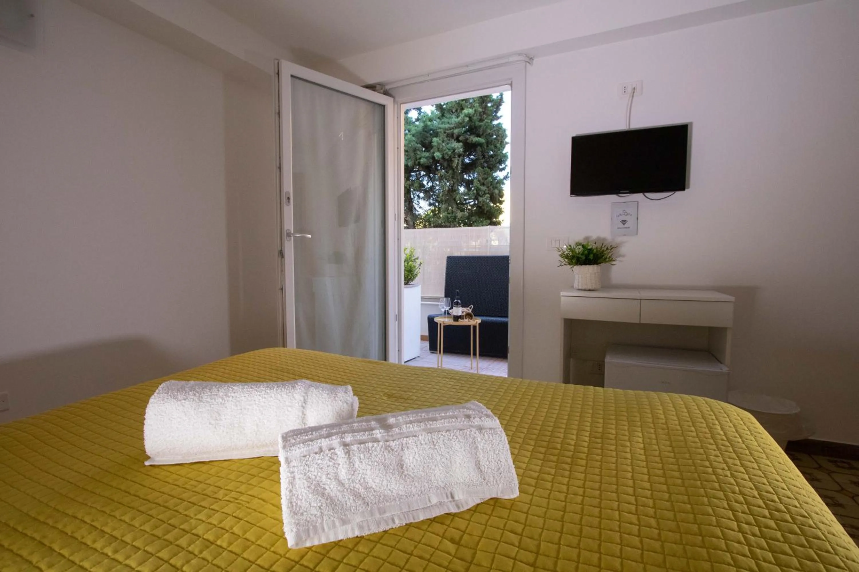 Bedroom, Bed in Le Torrette Rooms and Apartments