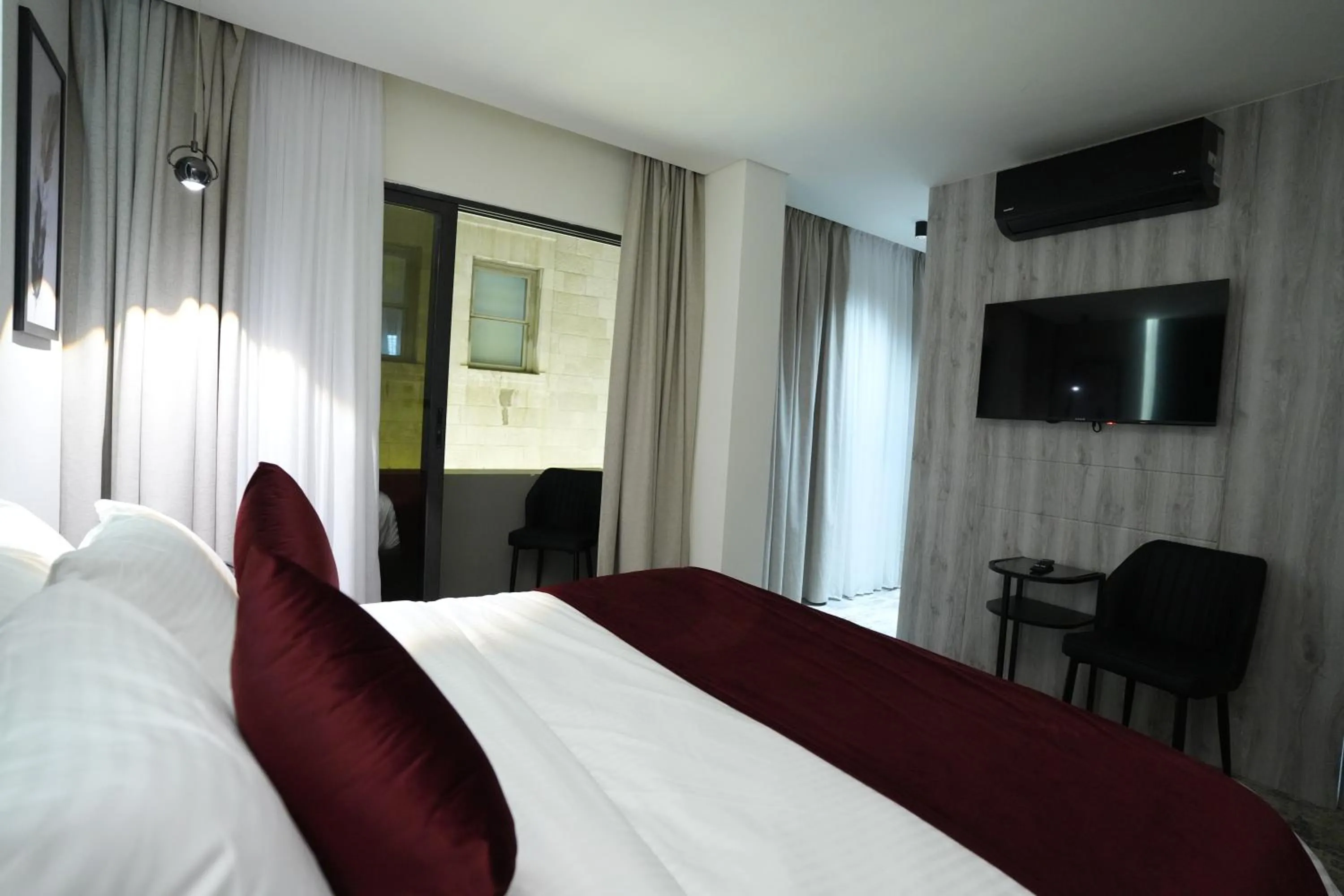 Bed in Roya Downtown Boutique Hotel