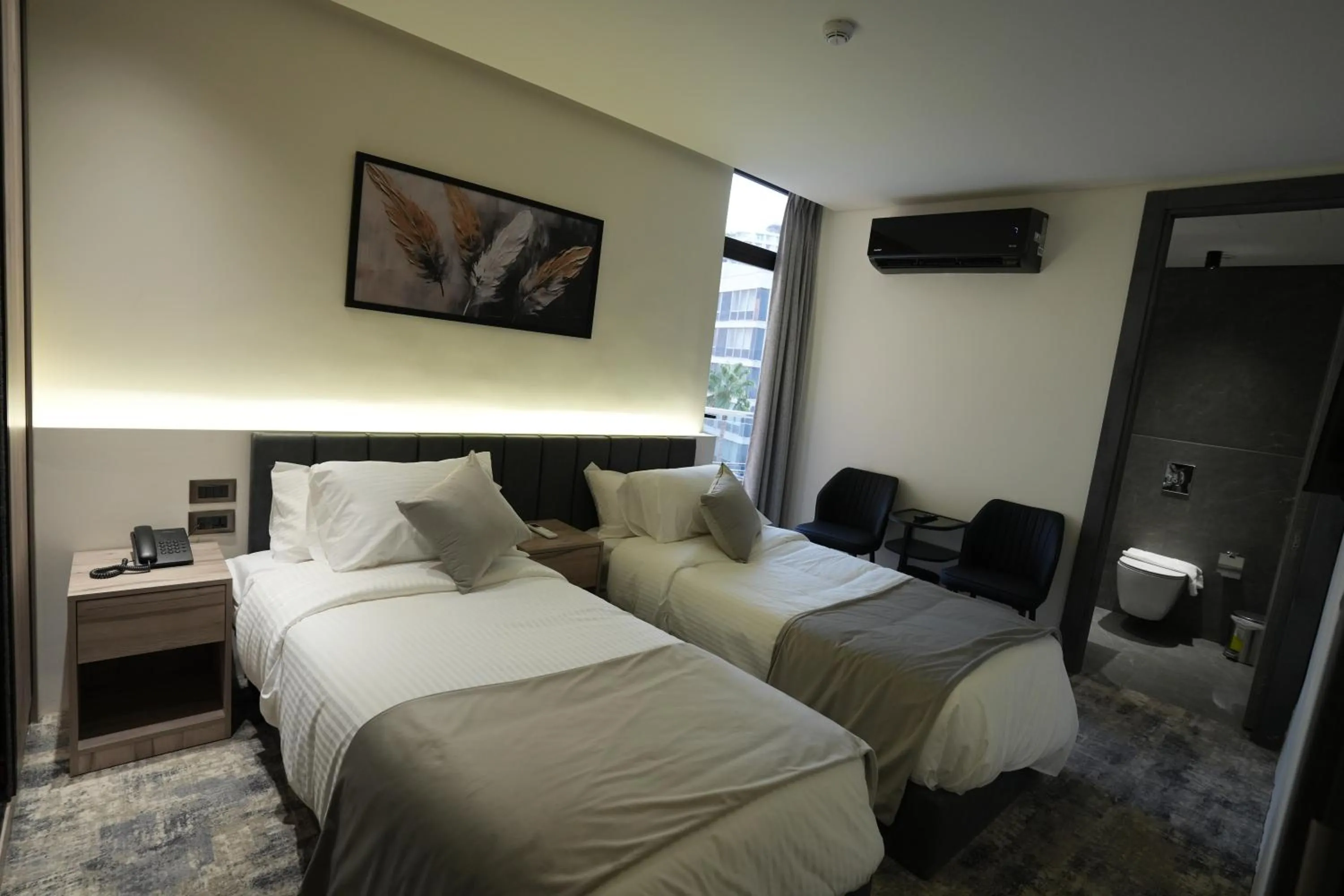 Bed in Roya Downtown Boutique Hotel