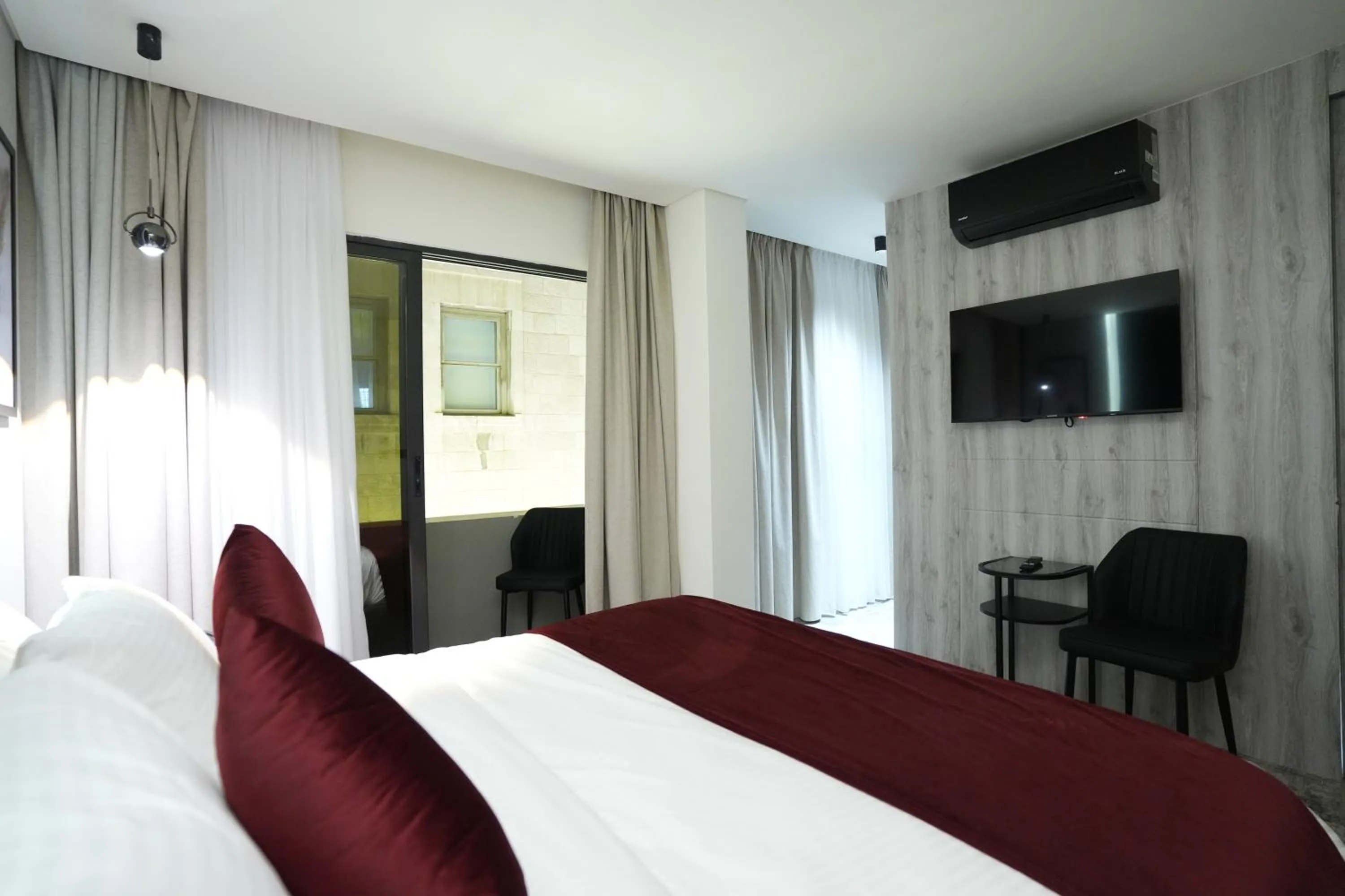 Bed in Roya Downtown Boutique Hotel
