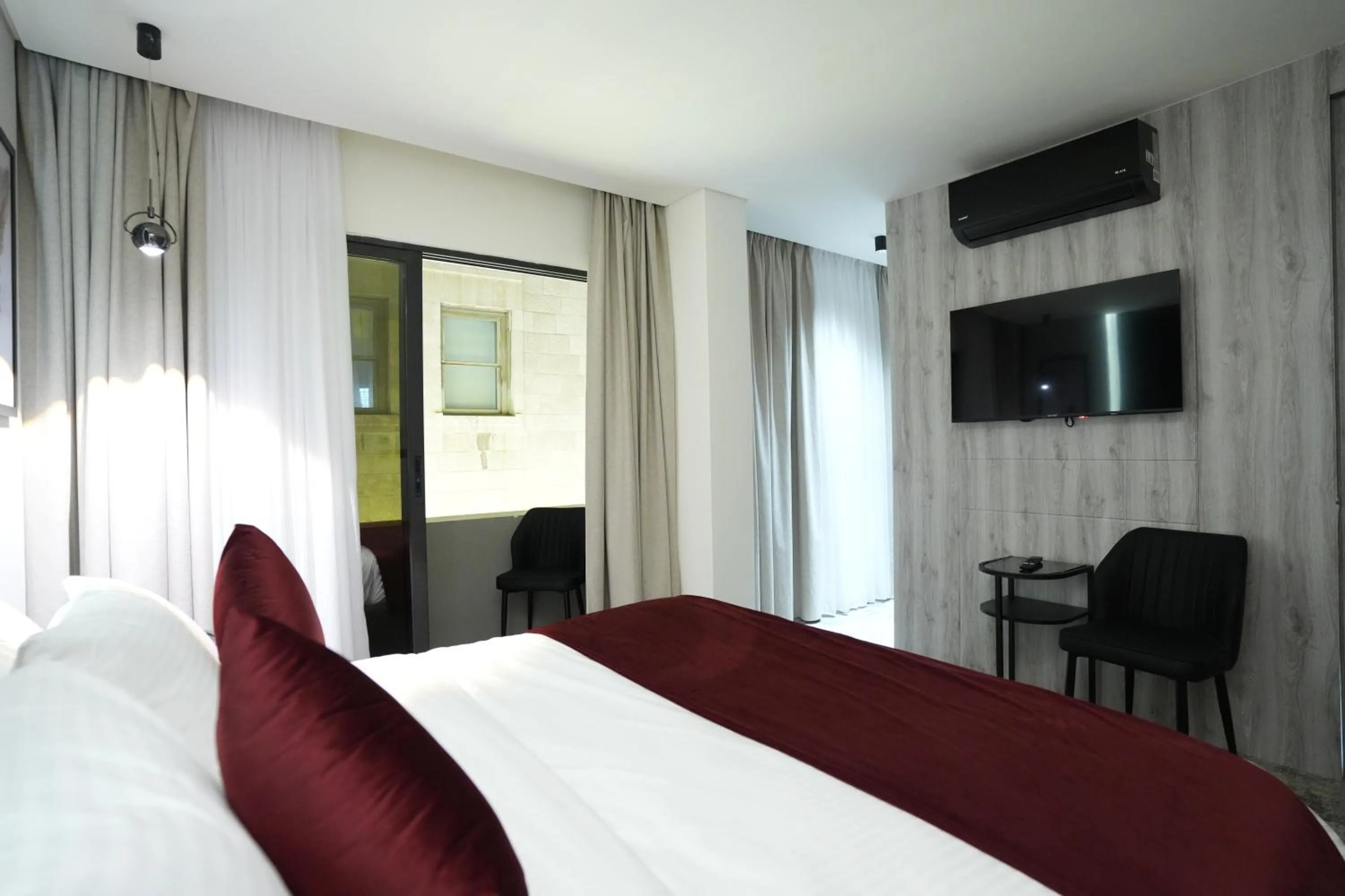Bed in Roya Downtown Boutique Hotel