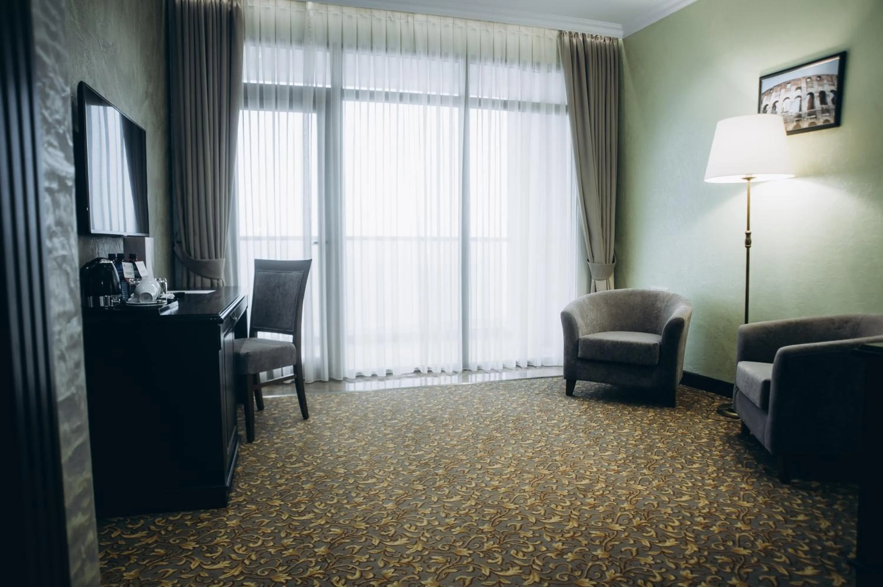 Communal lounge/ TV room in Colosseum Marina Hotel