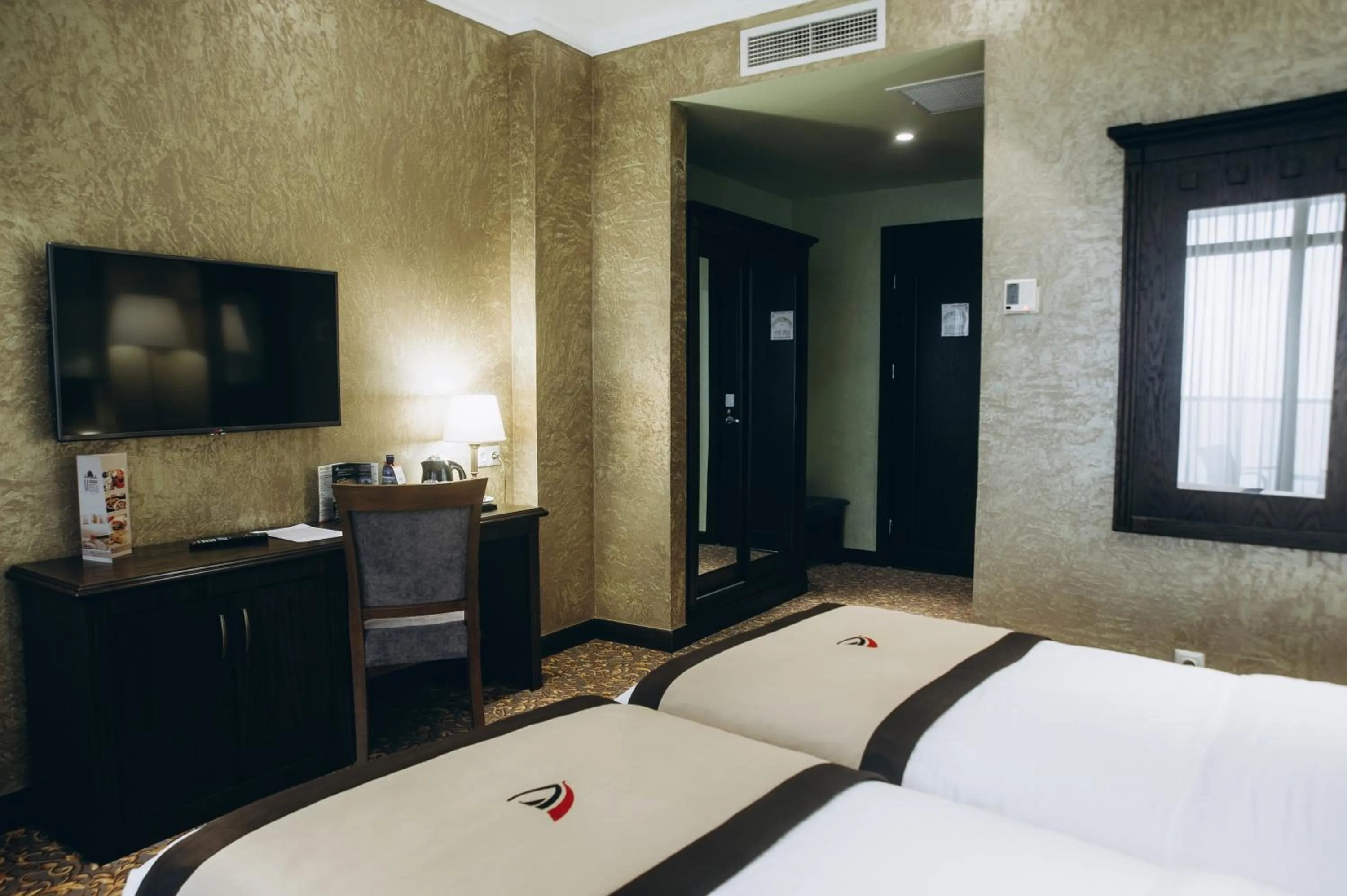 Bed in Colosseum Marina Hotel