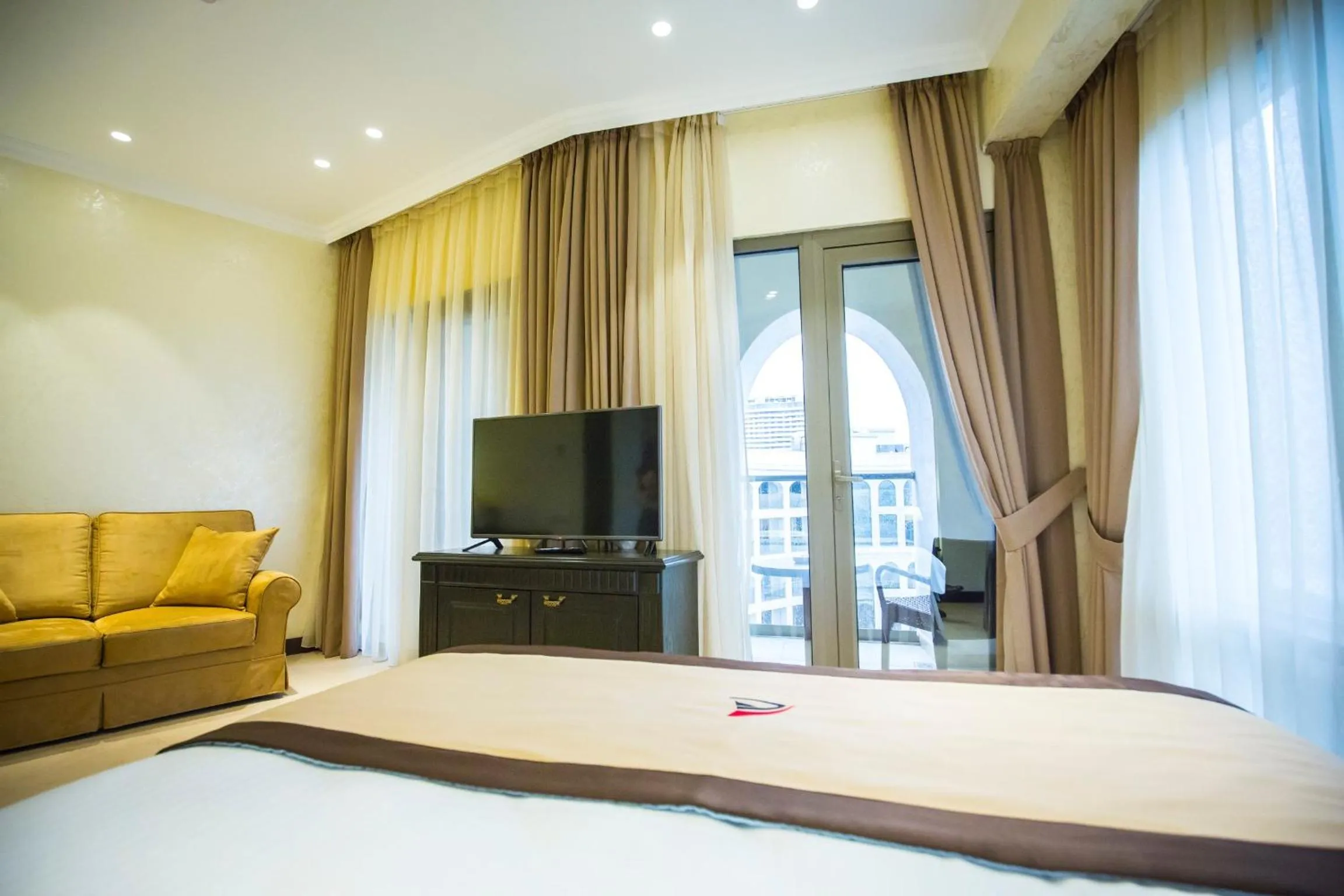 Seating area, Bed in Colosseum Marina Hotel