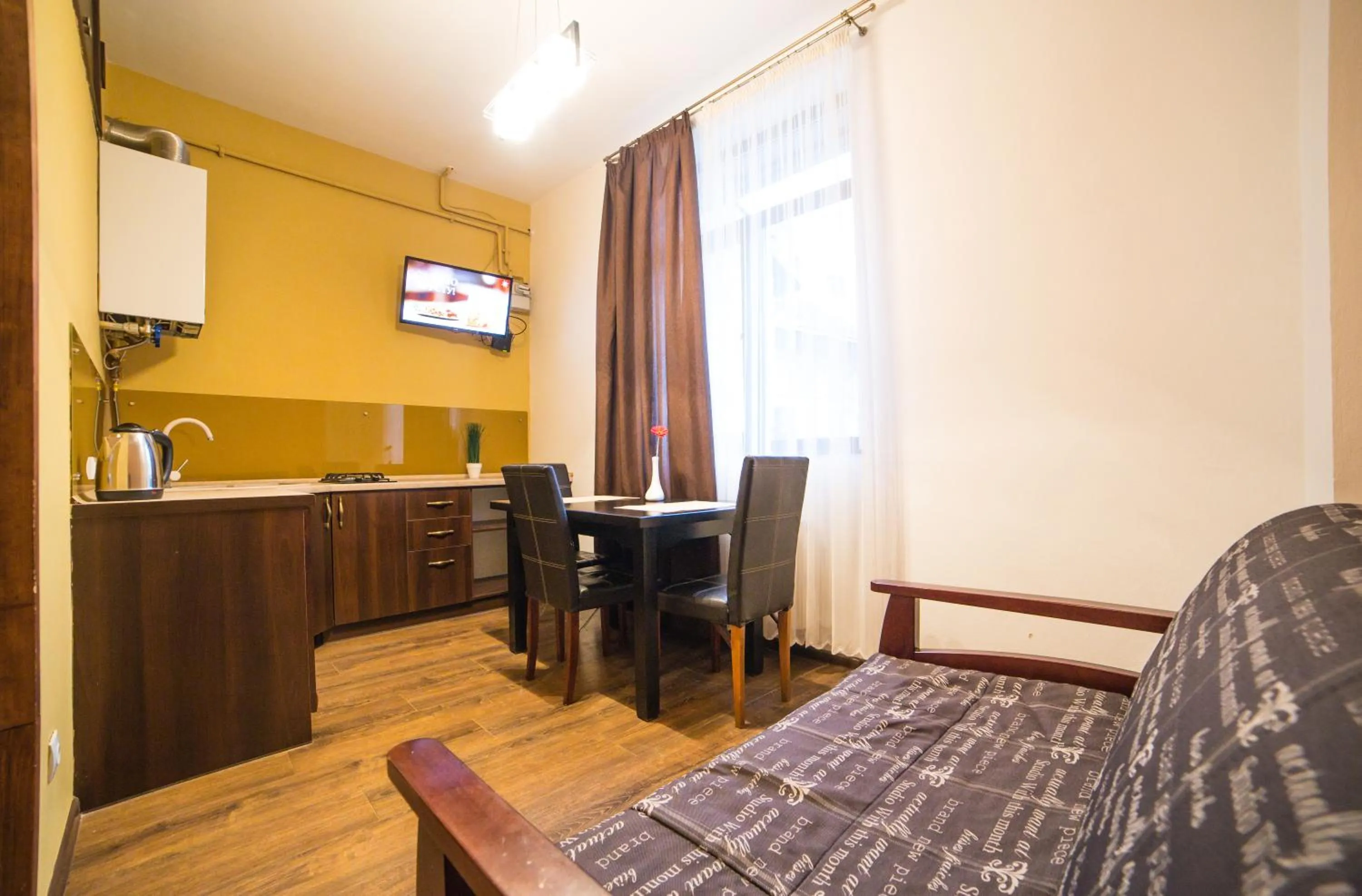 Kitchen or kitchenette, Bed in Aparthotel Na Mytniy