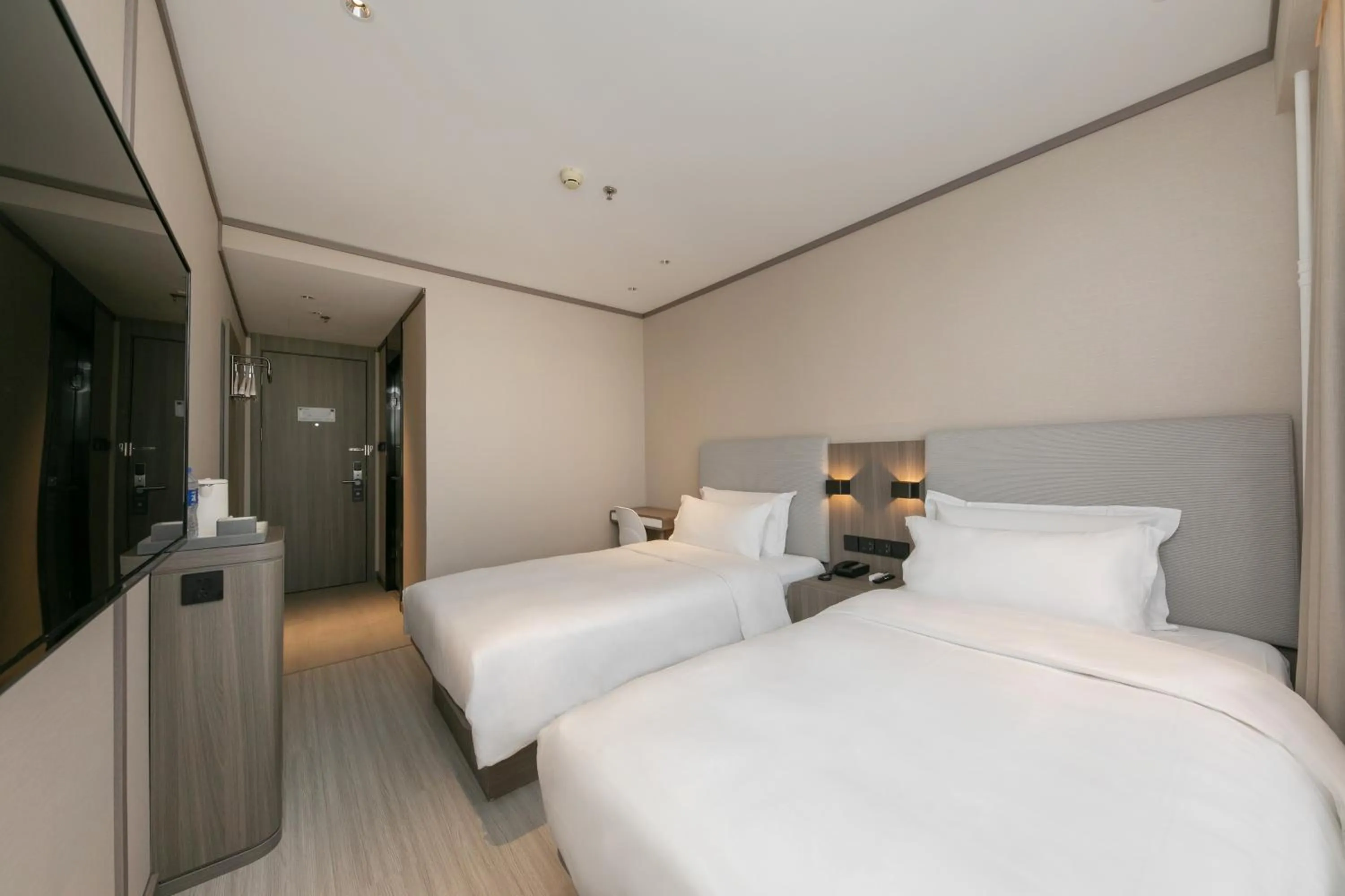 Bed in Hanting Hotel Beijing South Railway Station Gongyi Dongqiao