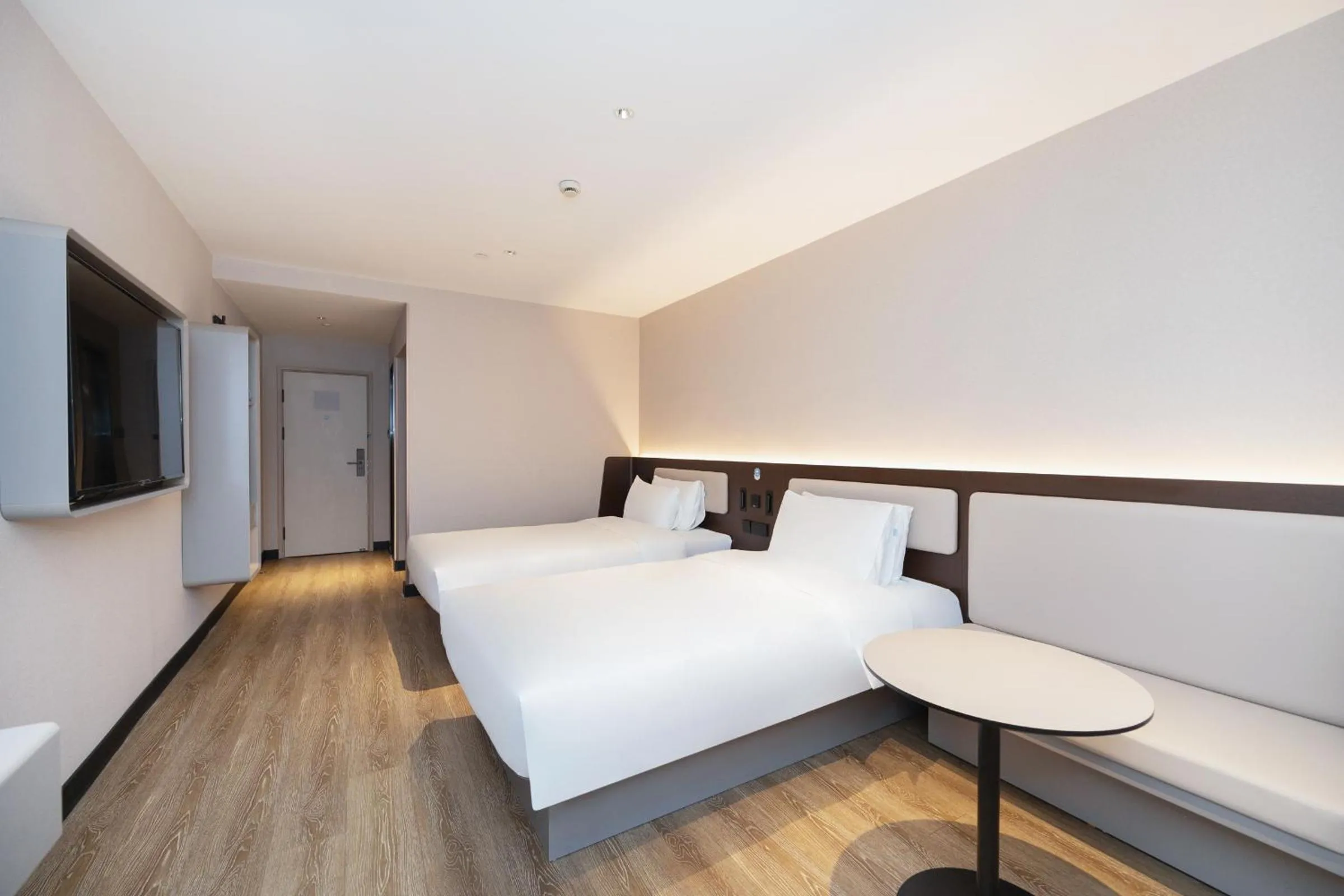 Bed in Hanting Hotel Shanghai North Sichuan Road Subway Station