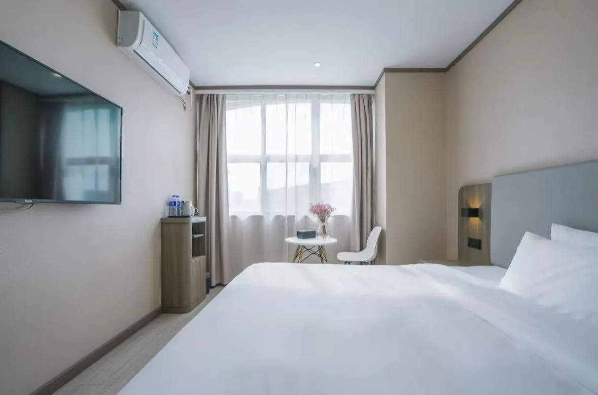 Bed in Hanting Hotel Shanghai Songjiang Sijing