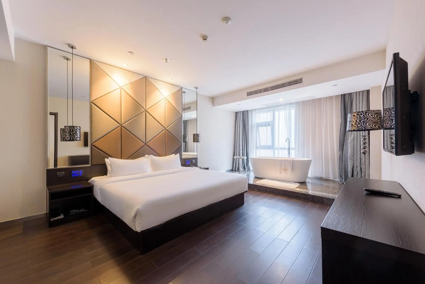 Bed in Orange Hotel Hangzhou Jiubao Passenger Transport Center