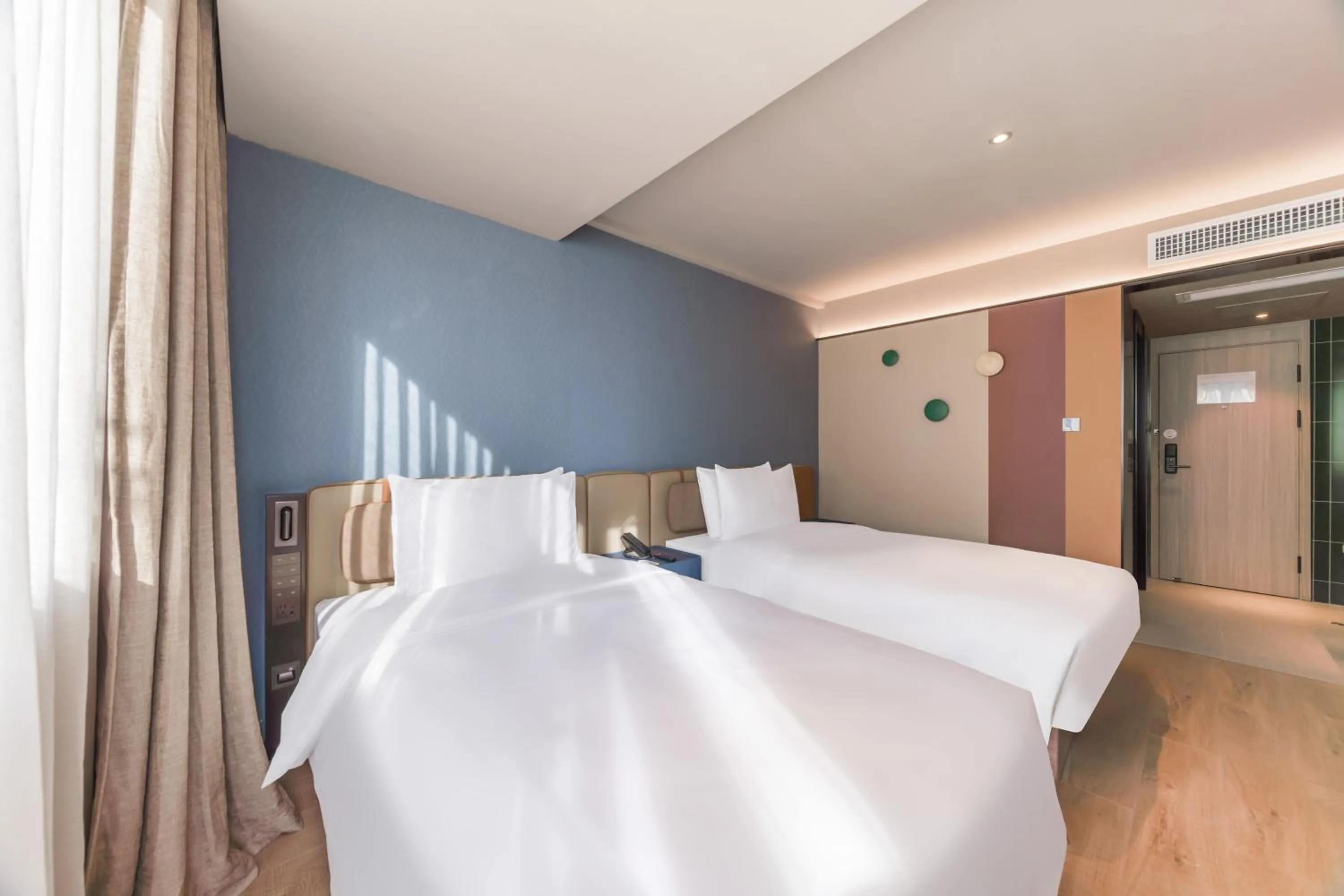 Bed in Orange Hotel Guangzhou Tianhe Gangding Subway Station