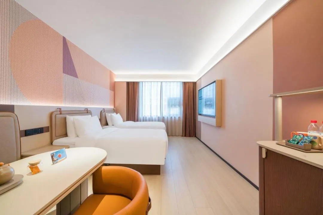 Bed in Orange Hotel Hangzhou West Lake Huanglong Sports Center