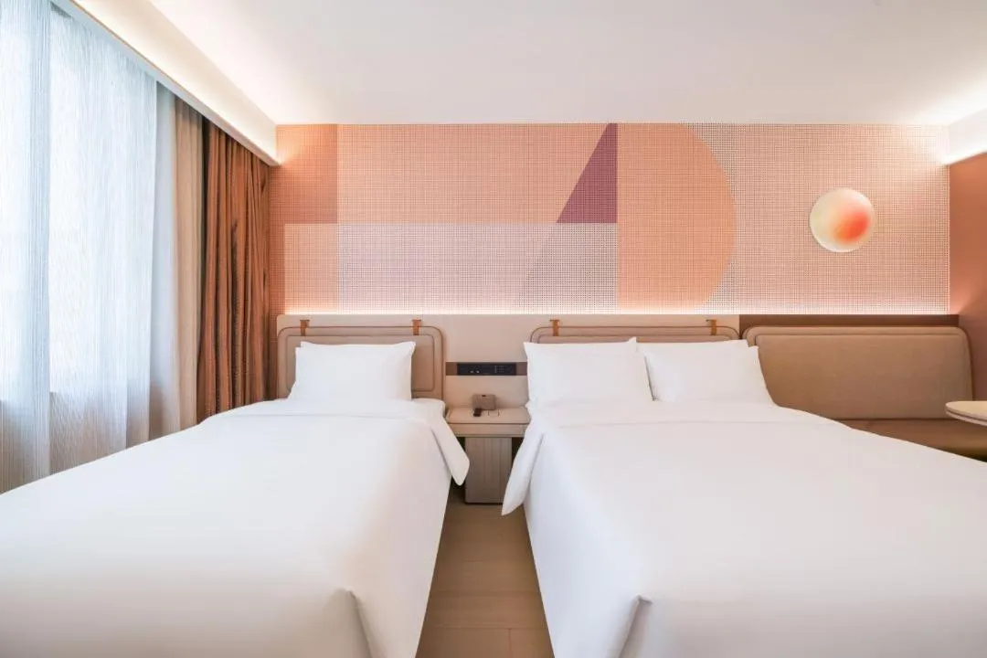 Bed in Orange Hotel Hangzhou West Lake Huanglong Sports Center