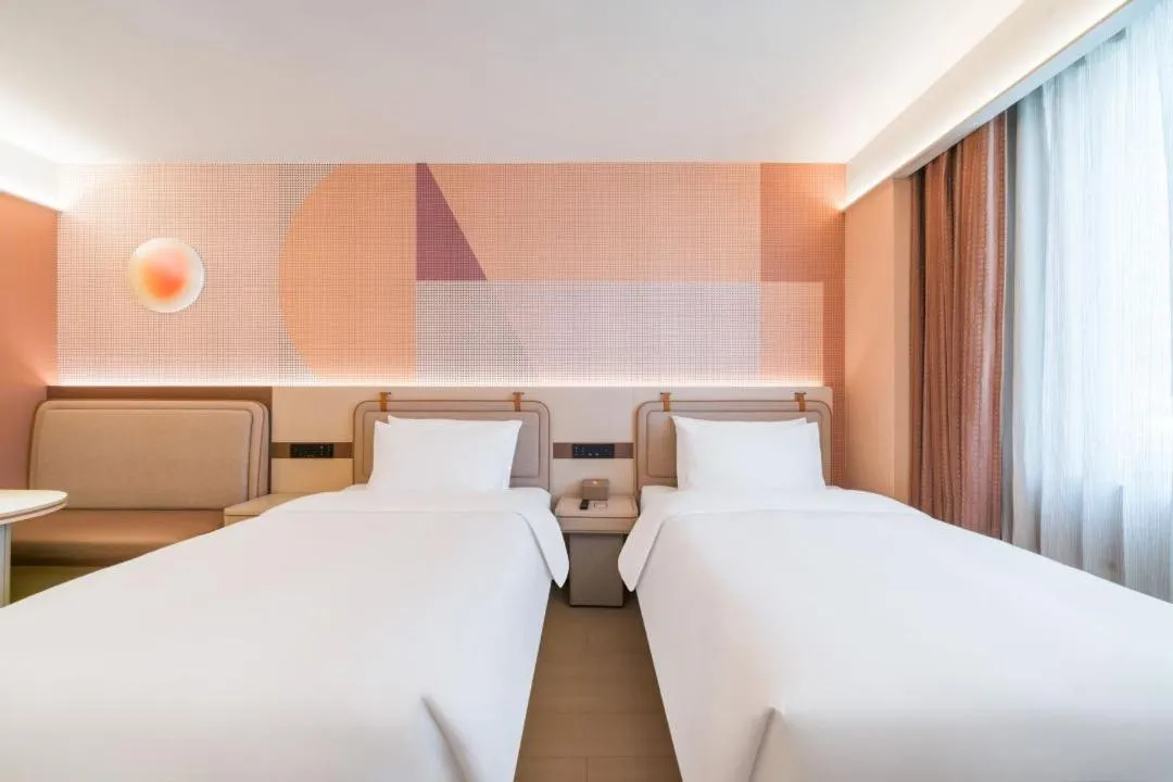 Bed in Orange Hotel Hangzhou West Lake Huanglong Sports Center